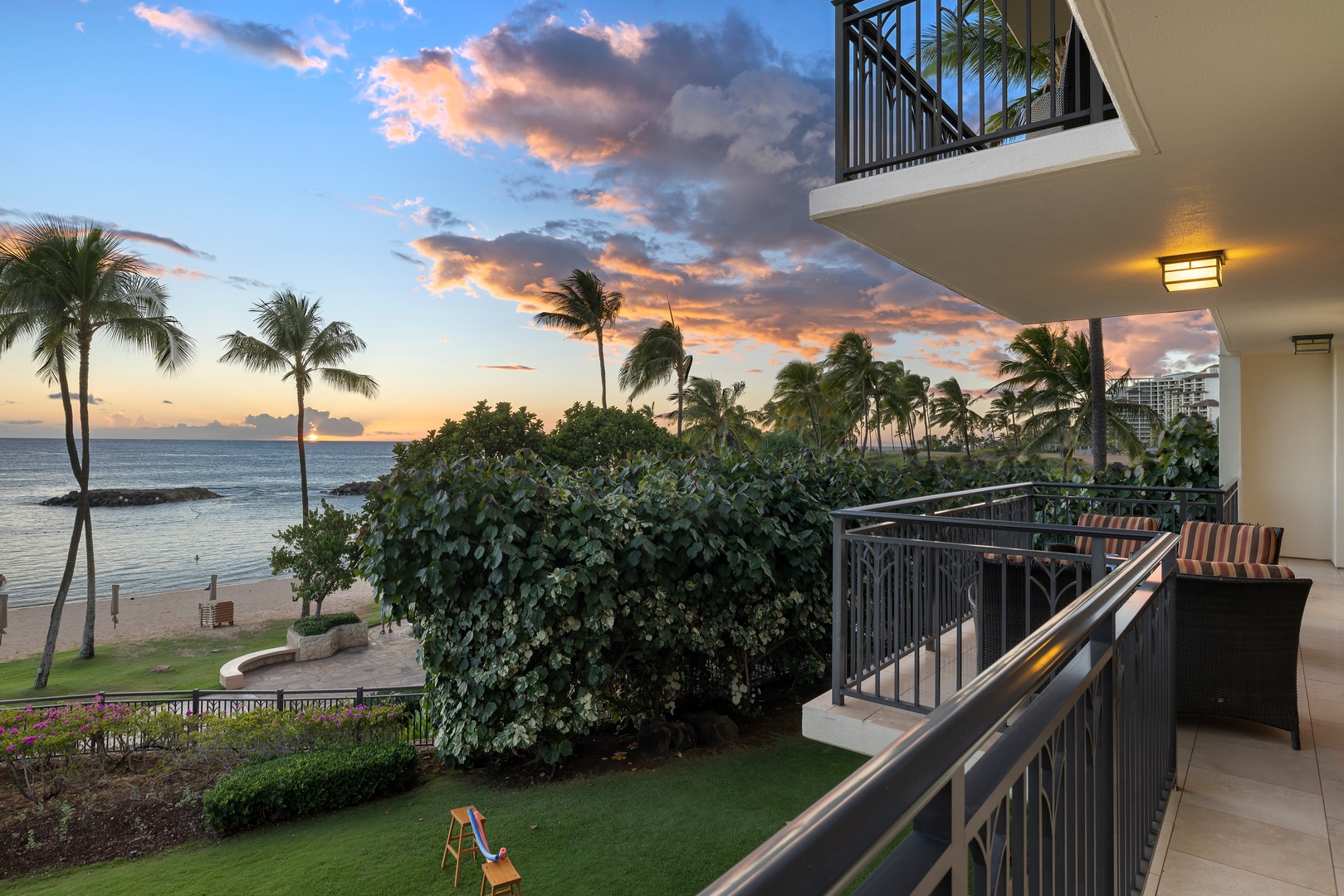 Kapolei Vacation Rentals, Ko Olina Beach Villas B210 - Evening skies from the lanai with palm-framed ocean views.