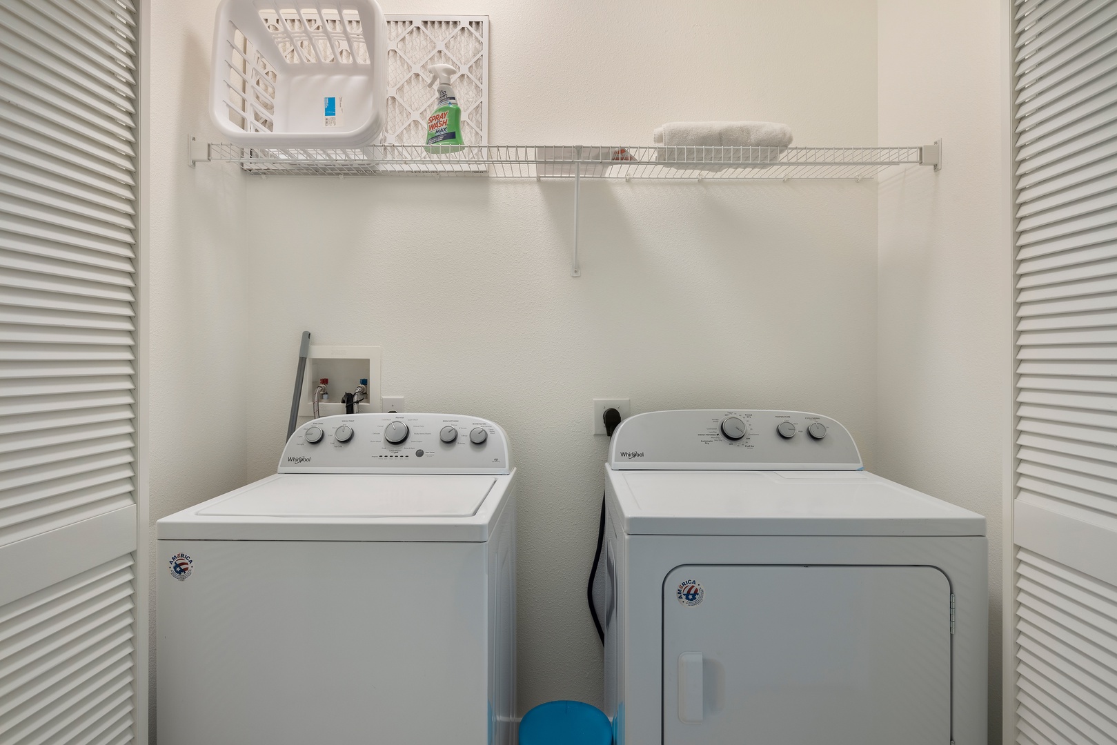 Kapolei Vacation Rentals, Coconut Plantation 1078-3 - Convenient laundry room with a washer, dryer, and storage shelf.