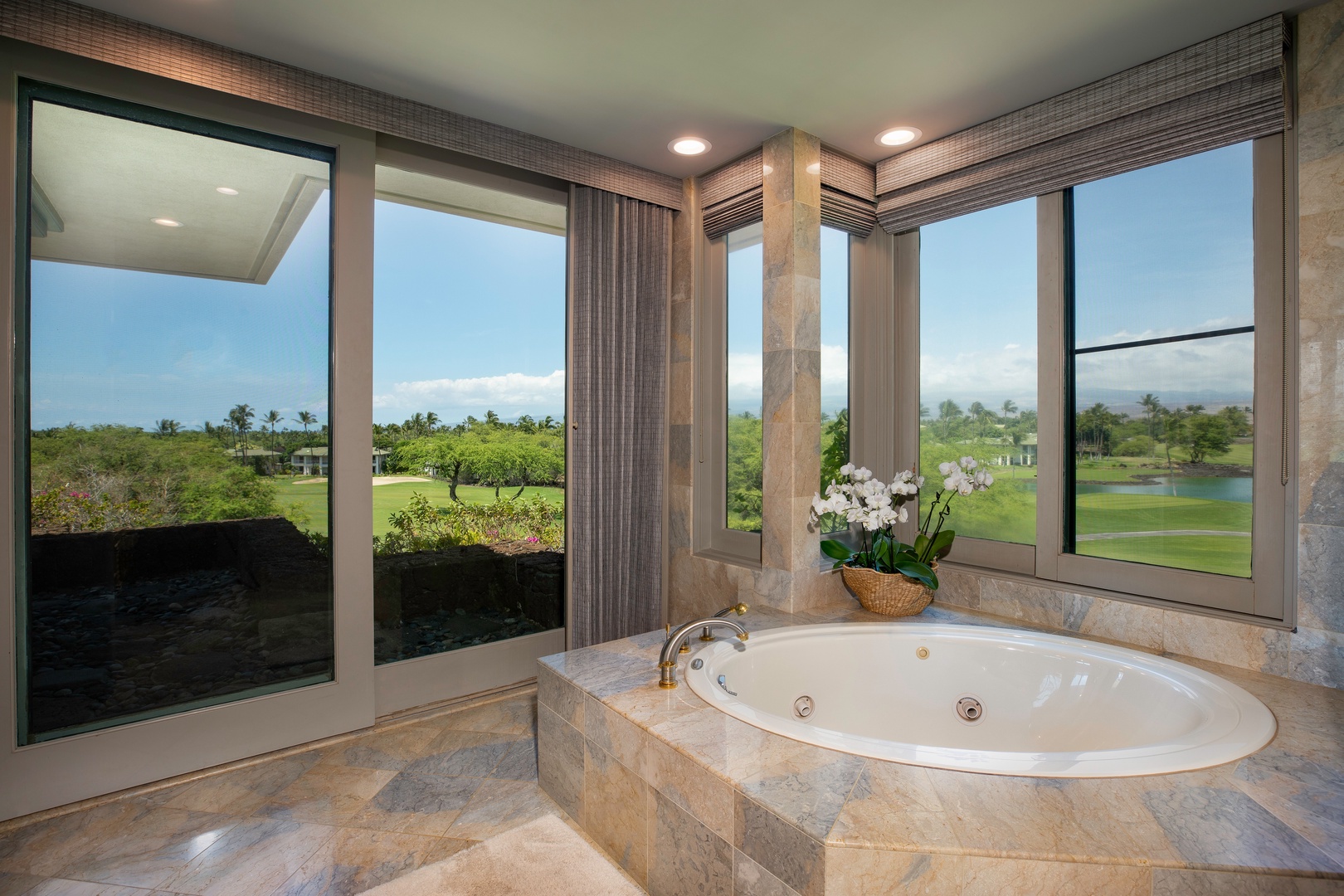 Kamuela Vacation Rentals, Canoe House at Champion Ridge - Luxurious bathroom featuring a soaking tub and a spacious walk-in shower.