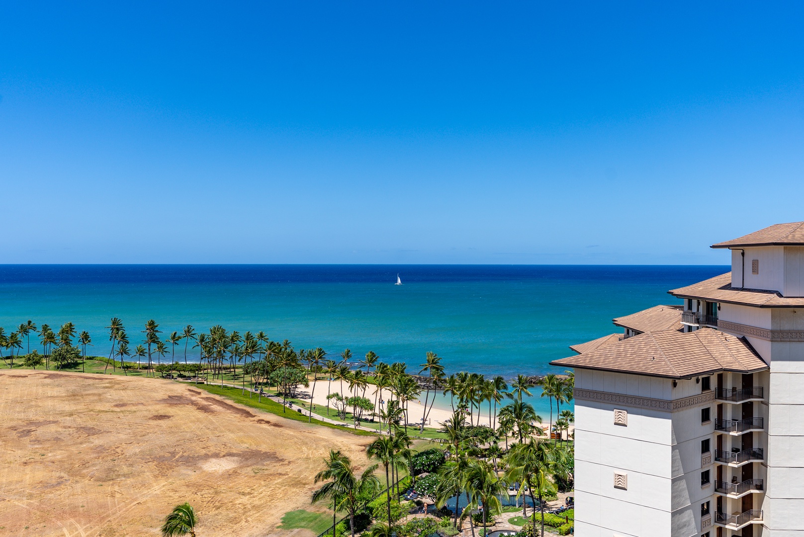 Kapolei Vacation Rentals, Ko Olina Beach Villas O1404 - Trace the coastline from this height, the lagoon turning turquoise toward the open ocean.