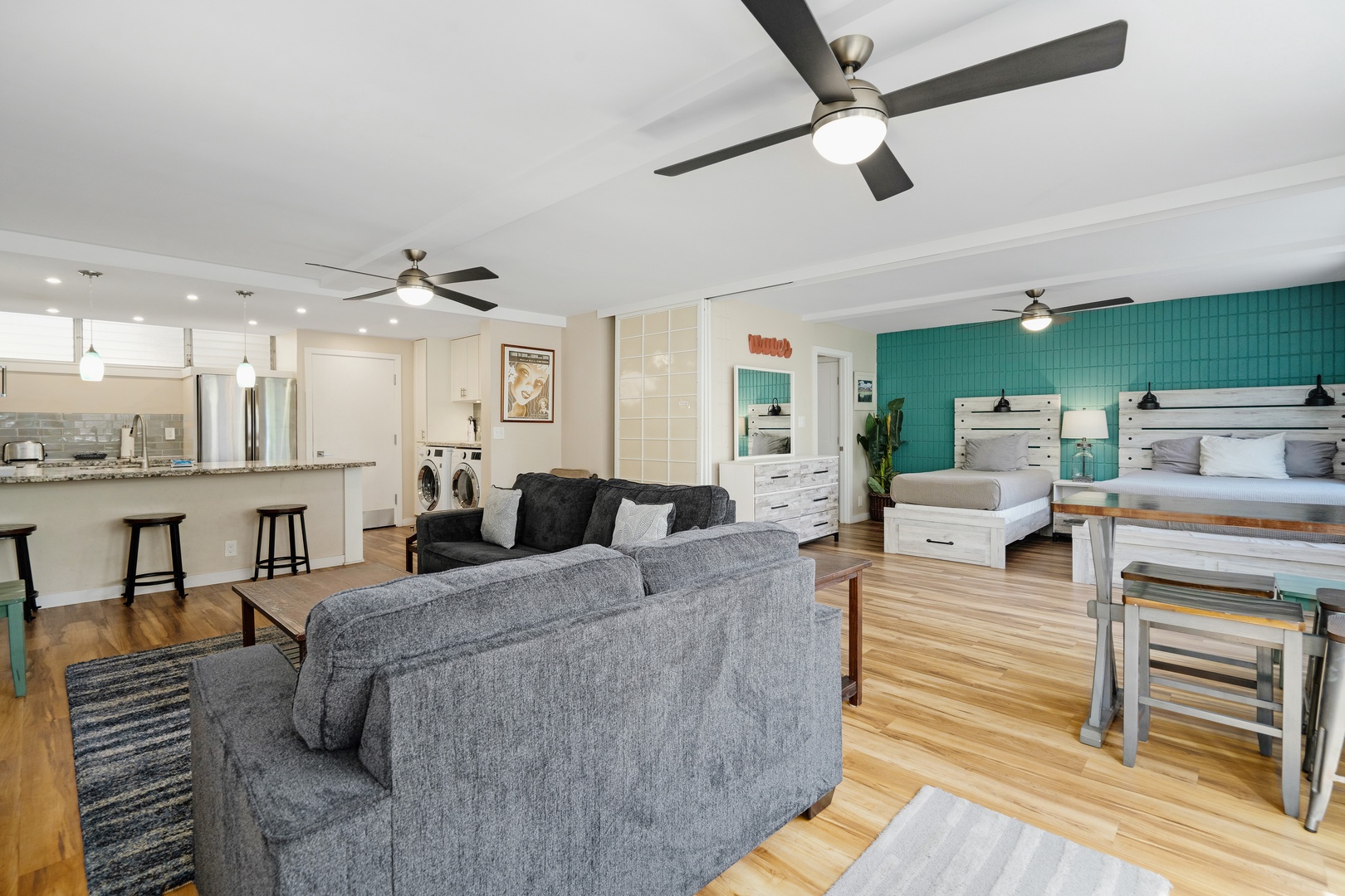 Kihei Vacation Rentals, Haleakala Shores A206 - Teal tile brightens the second bedroom's back wall, its glow visible clear across the open living room.