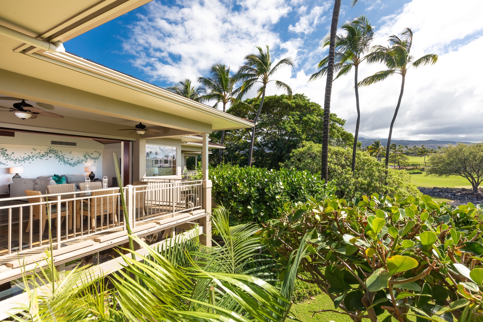 Kailua Kona Vacation Rentals, 3BD Waiulu Villa 111D at Hualalai Resort - Scenic balcony overlooking vibrant greenery and palm trees, offering a tranquil retreat.