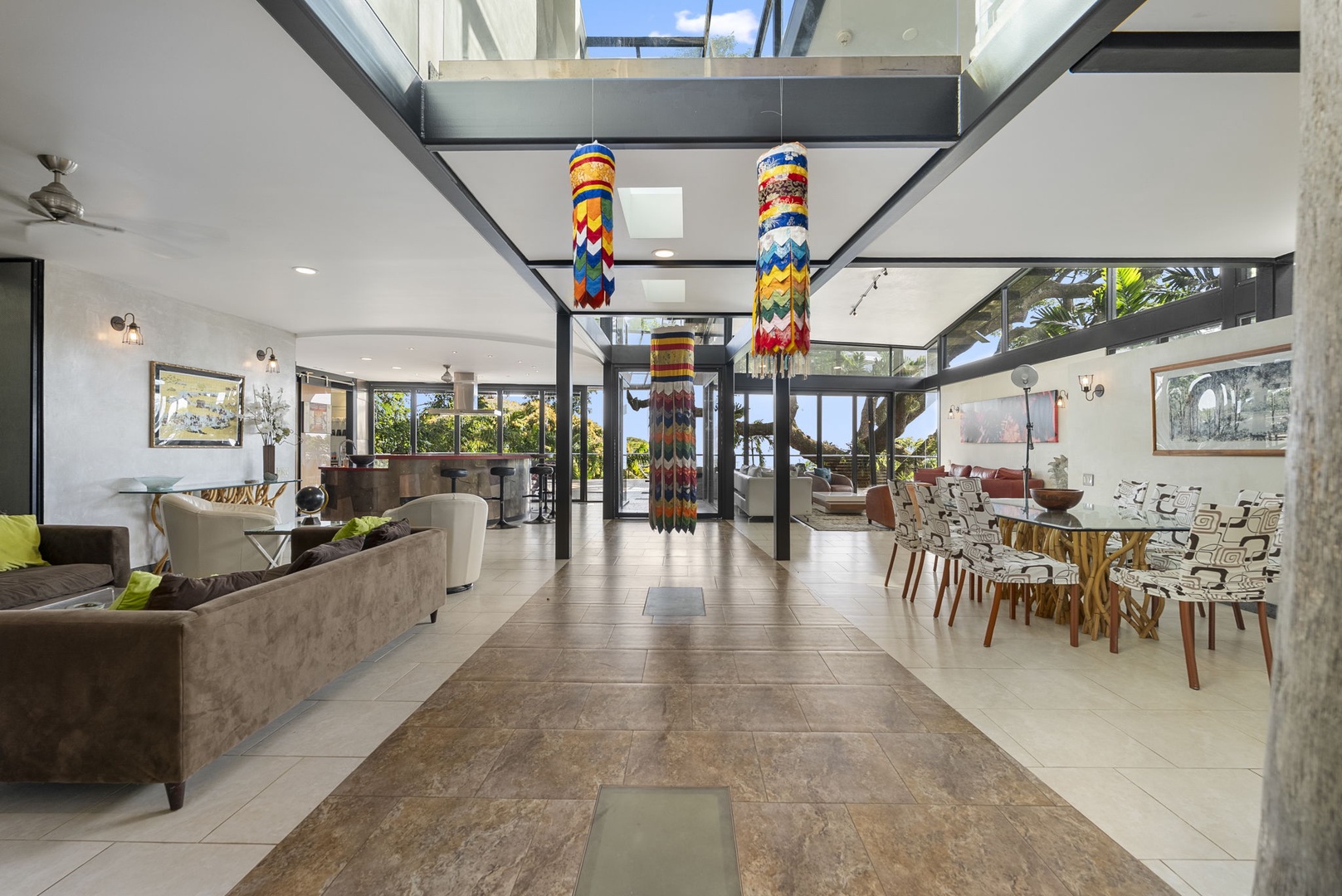 Honolulu Vacation Rentals, Tantalus Glass House (3 BD) - Your stunning open-plan living space features vibrant art, floor-to-ceiling windows, and seamless indoor-outdoor flow perfect for relaxing.