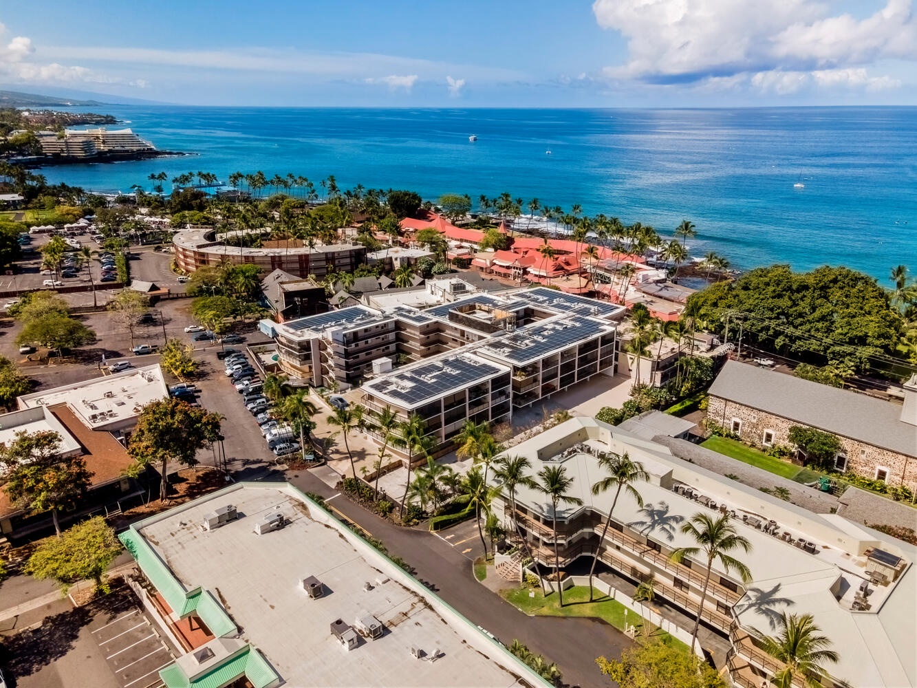 Kailua Kona Vacation Rentals, Kona Plaza 201 - Aerial view showcasing the property's prime coastal location with stunning ocean views and tropical surroundings.