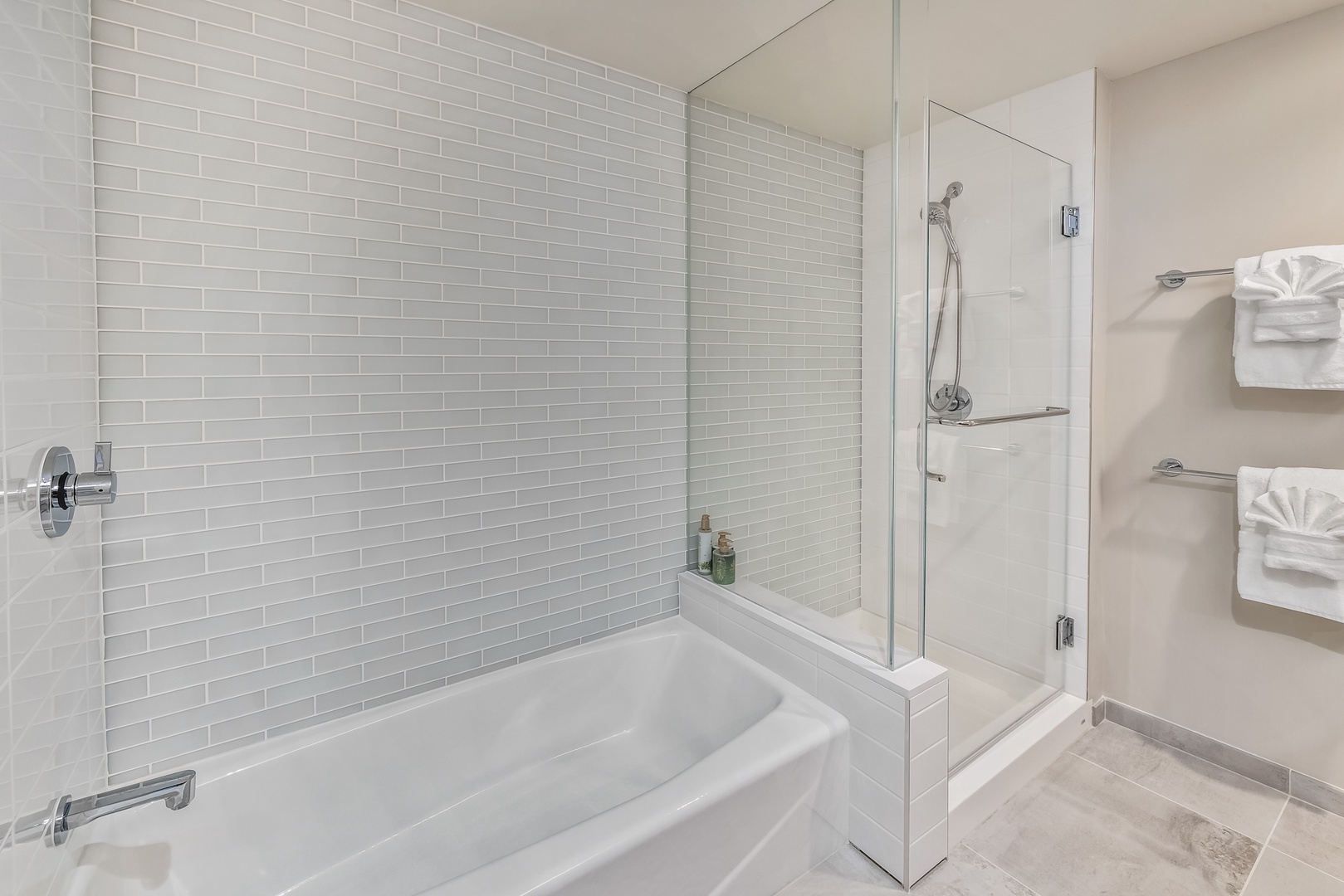 Honolulu Vacation Rentals, Sky Ala Moana #1701 - Elegant bathroom featuring a separate soaking tub and a glass-enclosed shower, offering a spa-like experience.