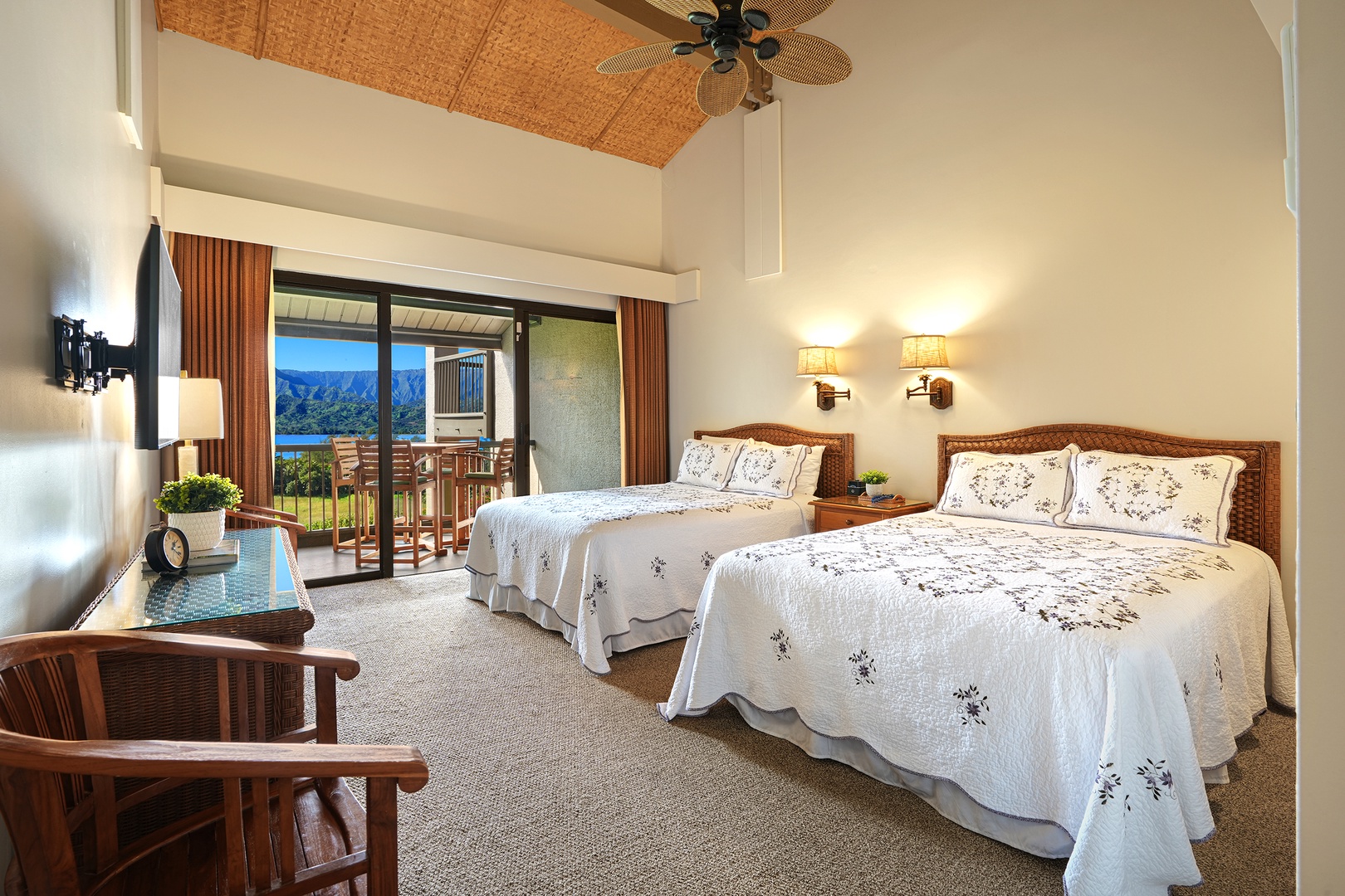 Princeville Vacation Rentals, Hanalei Bay Resort 4301/2/3 - Bedroom has two queen beds, TV, and private lanai. – Great for families or groups with added entertainment and outdoor access.