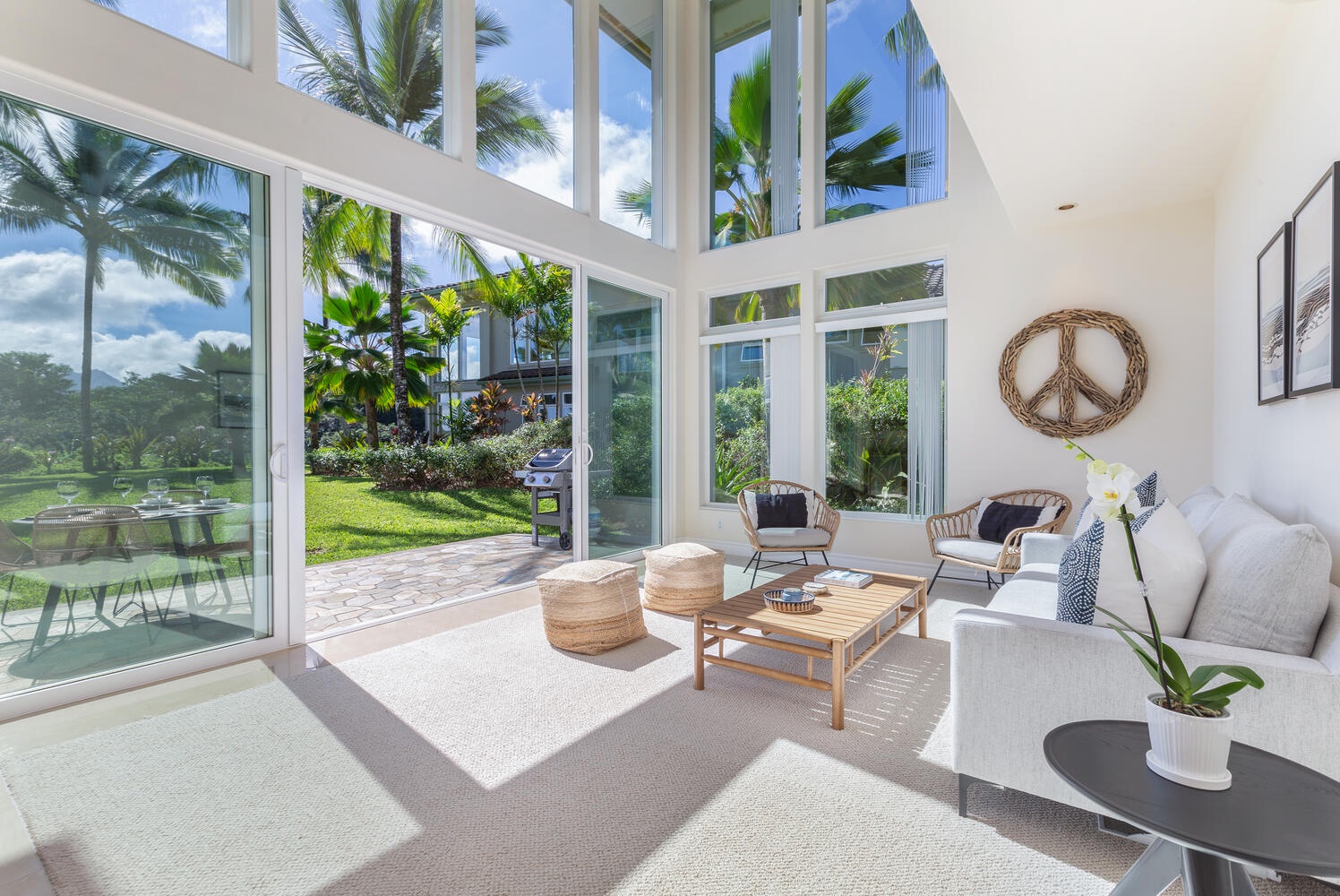 Princeville Vacation Rentals, Kai Naia Hale - Downstairs Family room opens up to lanai and beautiful garden