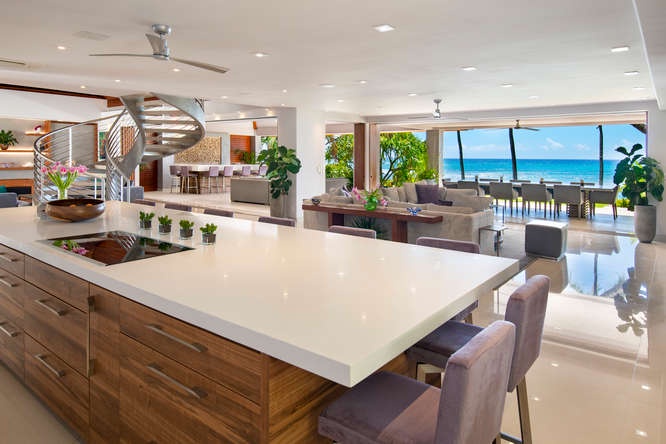 Honolulu Vacation Rentals, Diamond Head Beachfront Estate - Chef-style kitchen with ocean views, island seating, and top-tier appliances for effortless entertaining.