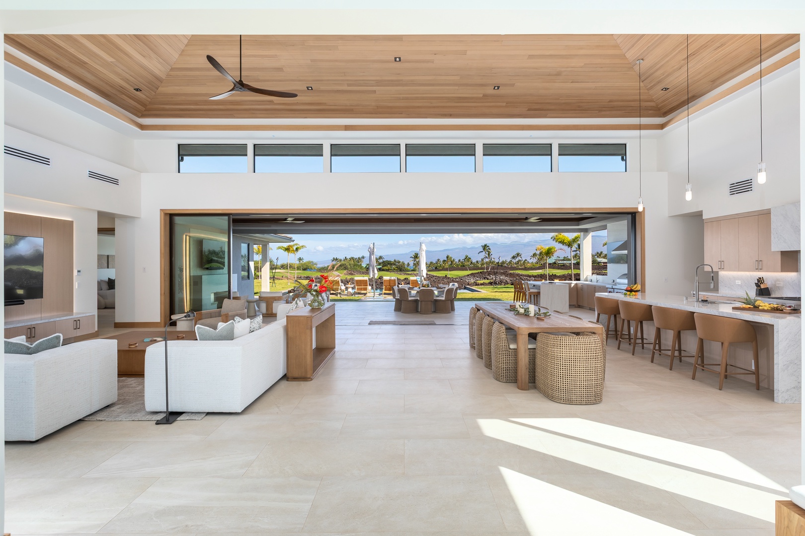 Kamuela Vacation Rentals, 5BD Mauna Lani Lux Ocean Estate (OE12) at One Ocean - Relax in your stunning open-concept living space where indoor luxury meets outdoor paradise through soaring glass doors.