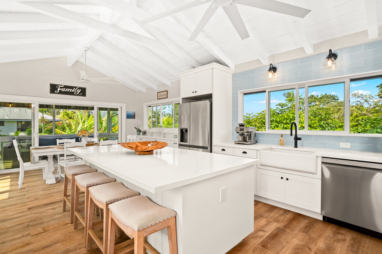 Princeville Vacation Rentals, Ola Hou - Main House - Enjoy a seamless flow between the kitchen and outdoor views for an island-inspired lifestyle.