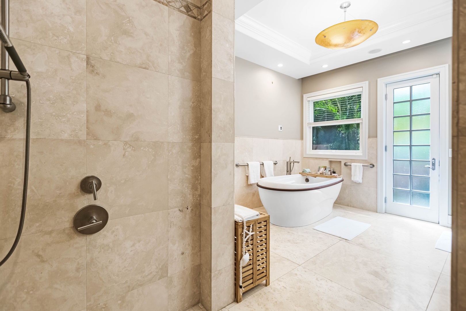 Honolulu Vacation Rentals, Pili Pono - Primary en-suite featuring a freestanding tub and walk-in shower.