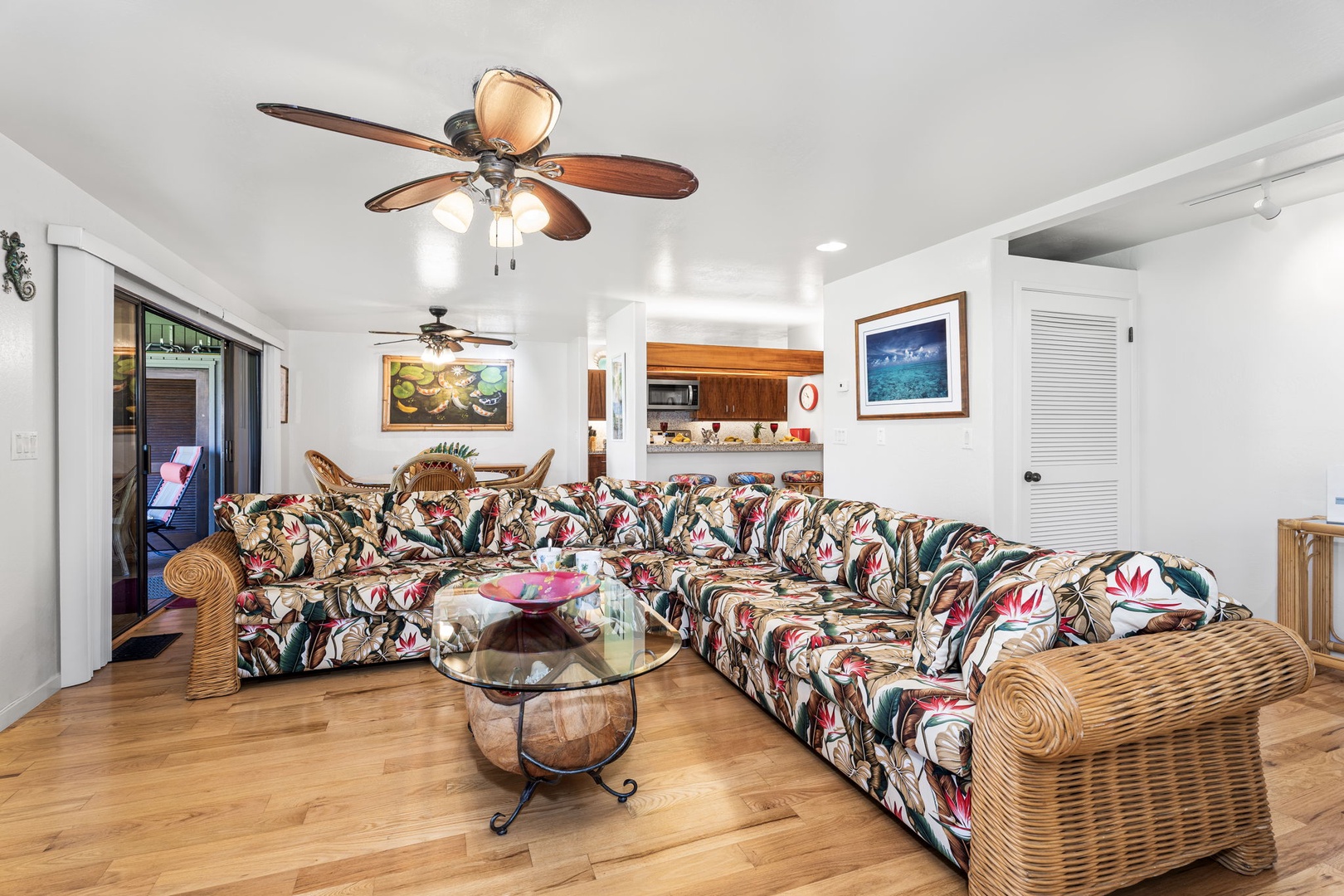 Kailua Kona Vacation Rentals, Kanaloa at Kona 701 - Relax in your tropical-themed living room with spacious sectional seating, perfect for gathering with loved ones after island adventures.