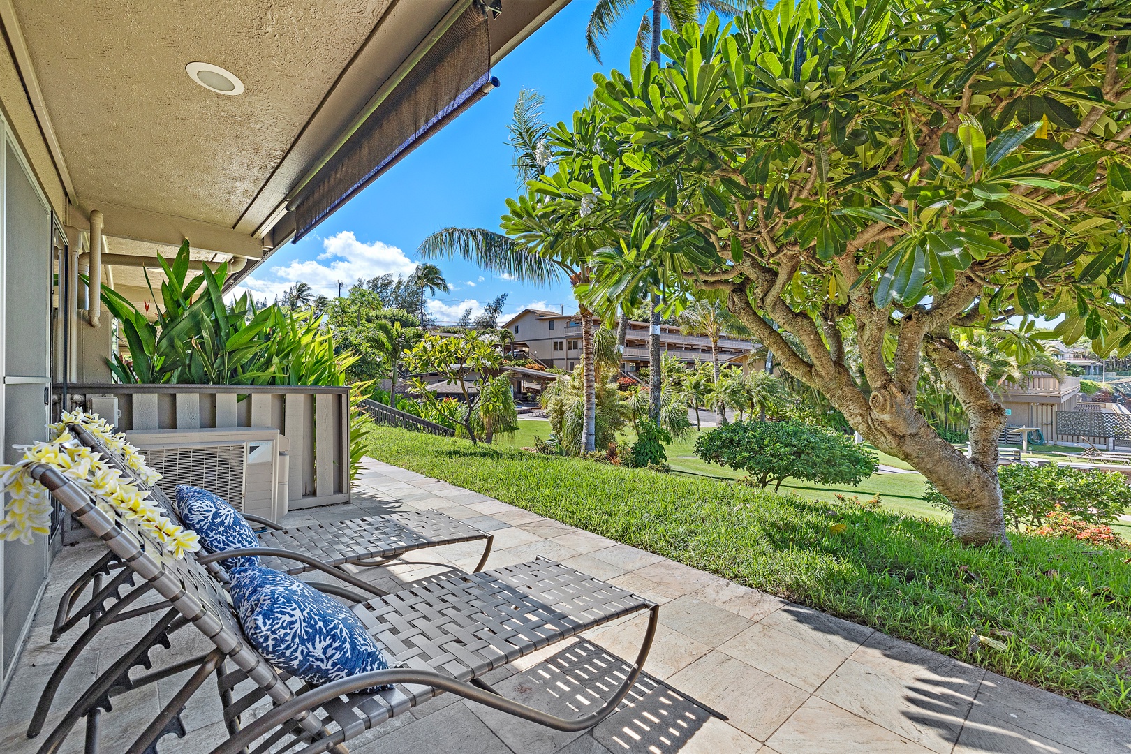 Lahaina Vacation Rentals, Kahana Sunset B4B - Relaxing lanai with lounge chairs & garden views at Kahana Sunset B4B.
