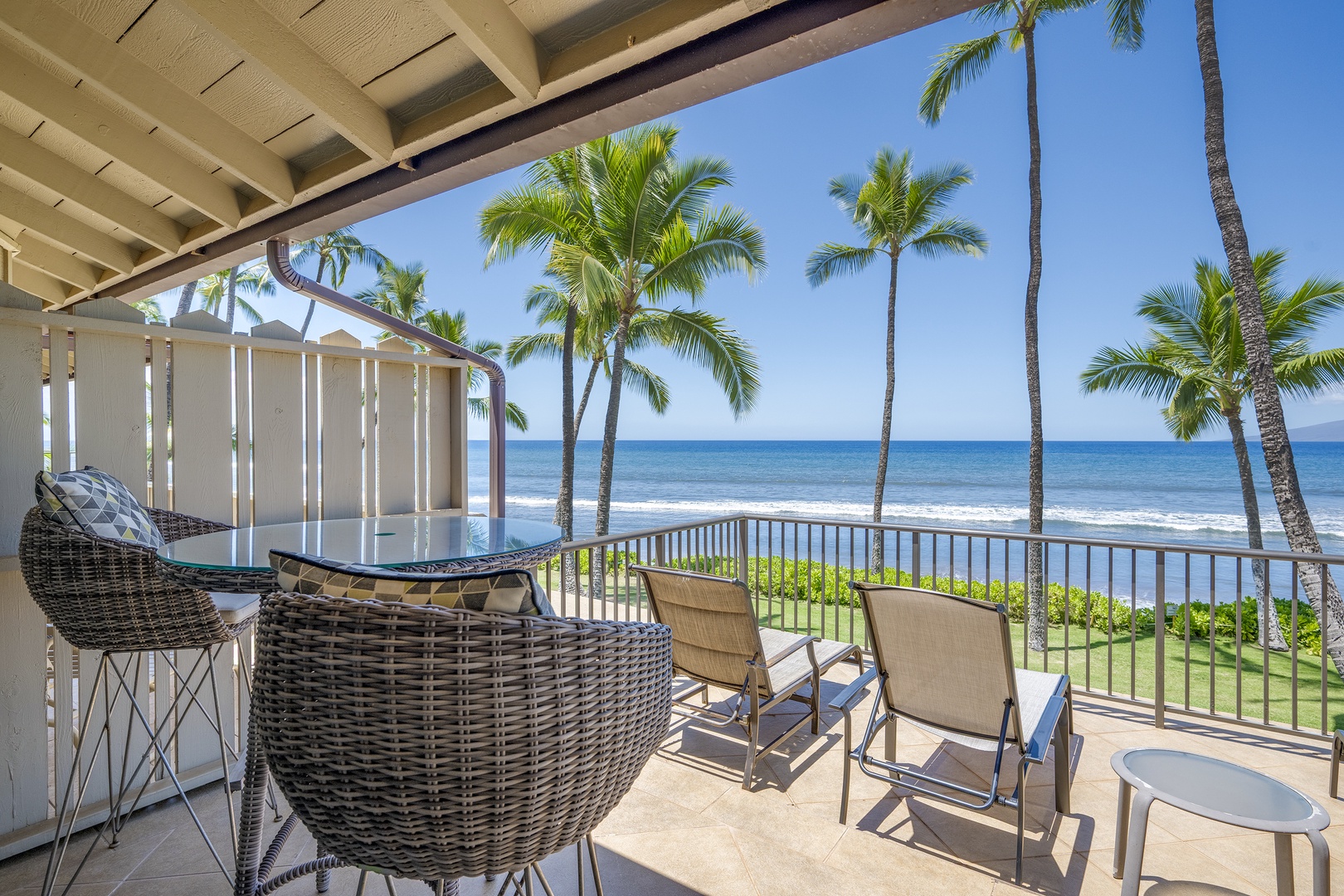 Lahaina Vacation Rentals, Puamana 240-3 - Relax in a private lounge area with stunning views of the ocean and a tropical breeze.