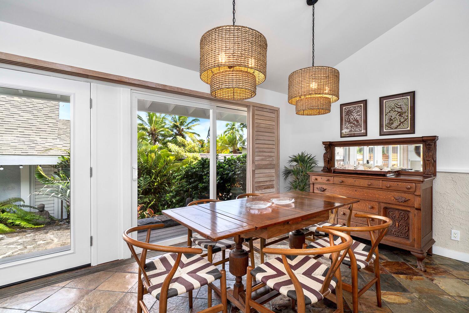 Kailua Kona Vacation Rentals, Manukai Hale - Seamless indoor-outdoor living in the dining area with direct access to the garden.