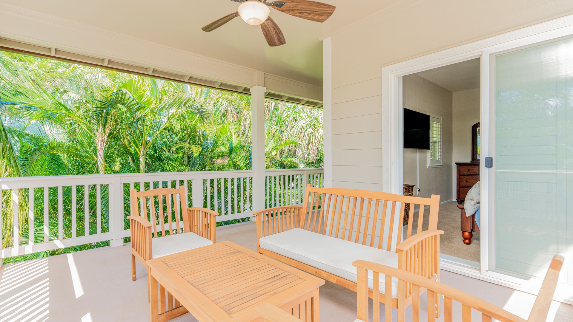 Kapolei Vacation Rentals, Coconut Plantation 1234-2 - The lanai is surrounded by tropical plants.