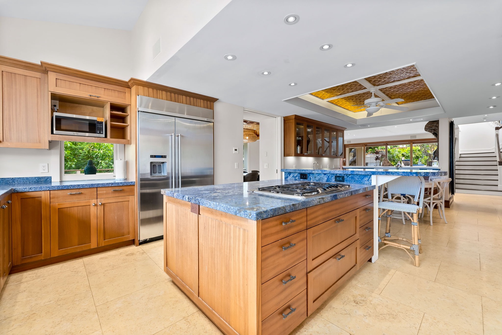 Kailua Vacation Rentals, Leaf House - Step into your fully equipped gourmet kitchen with granite countertops, stainless steel appliances, and ample prep space. Natural light flows through tropical views while you cook.