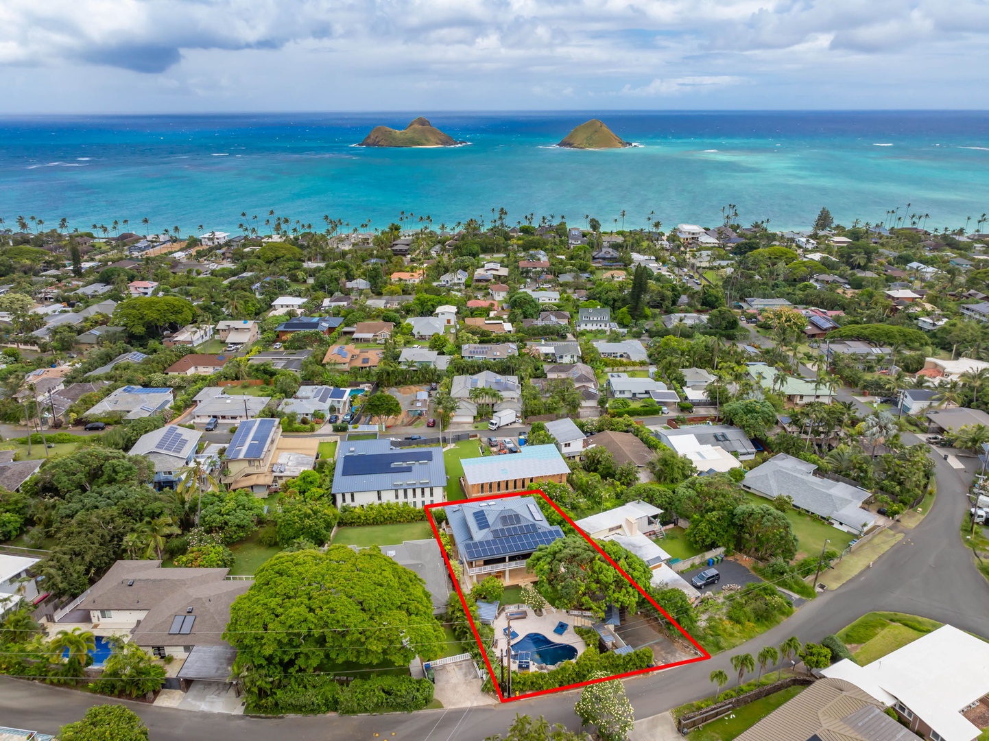 Kailua Vacation Rentals, Leaf House - Aerial view of a beachside neighborhood with the property outlined in red, nestled among lush greenery just a short stroll from turquoise waters and iconic offshore islands.