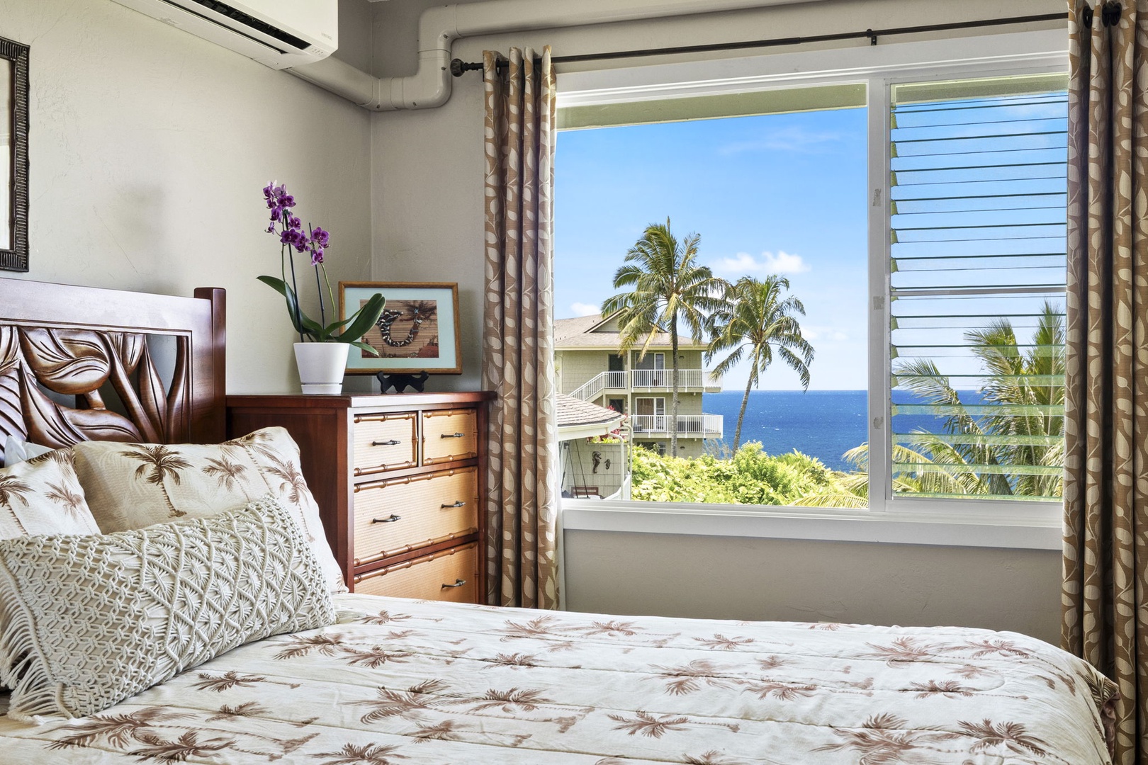 Princeville Vacation Rentals, Alii Kai 7201 - Palms and open water fill the window beside the bed, first thing every morning.