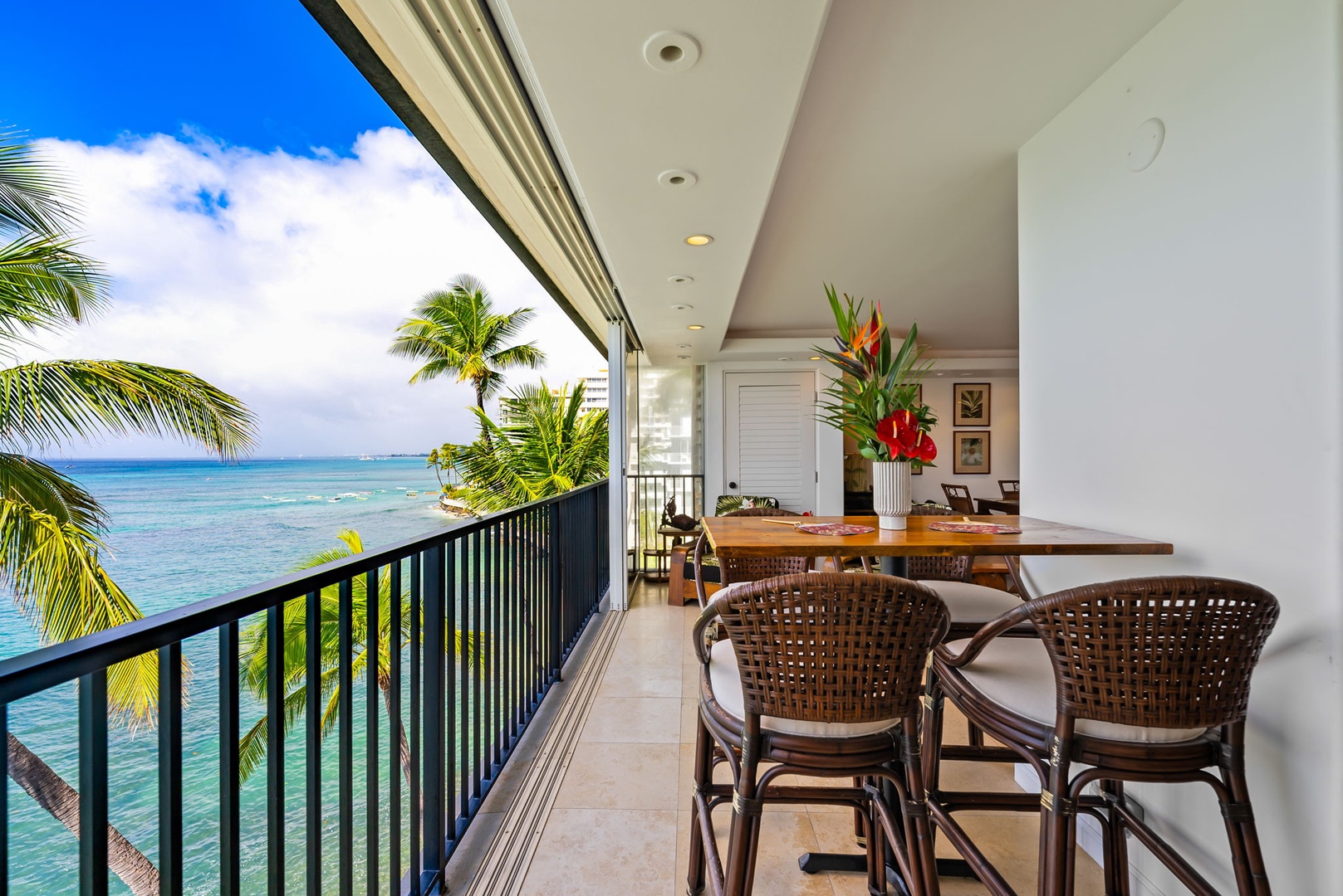 Honolulu Vacation Rentals, Kaimana Views - Balcony dining area overlooking the ocean, perfect for savoring meals with an unforgettable view.