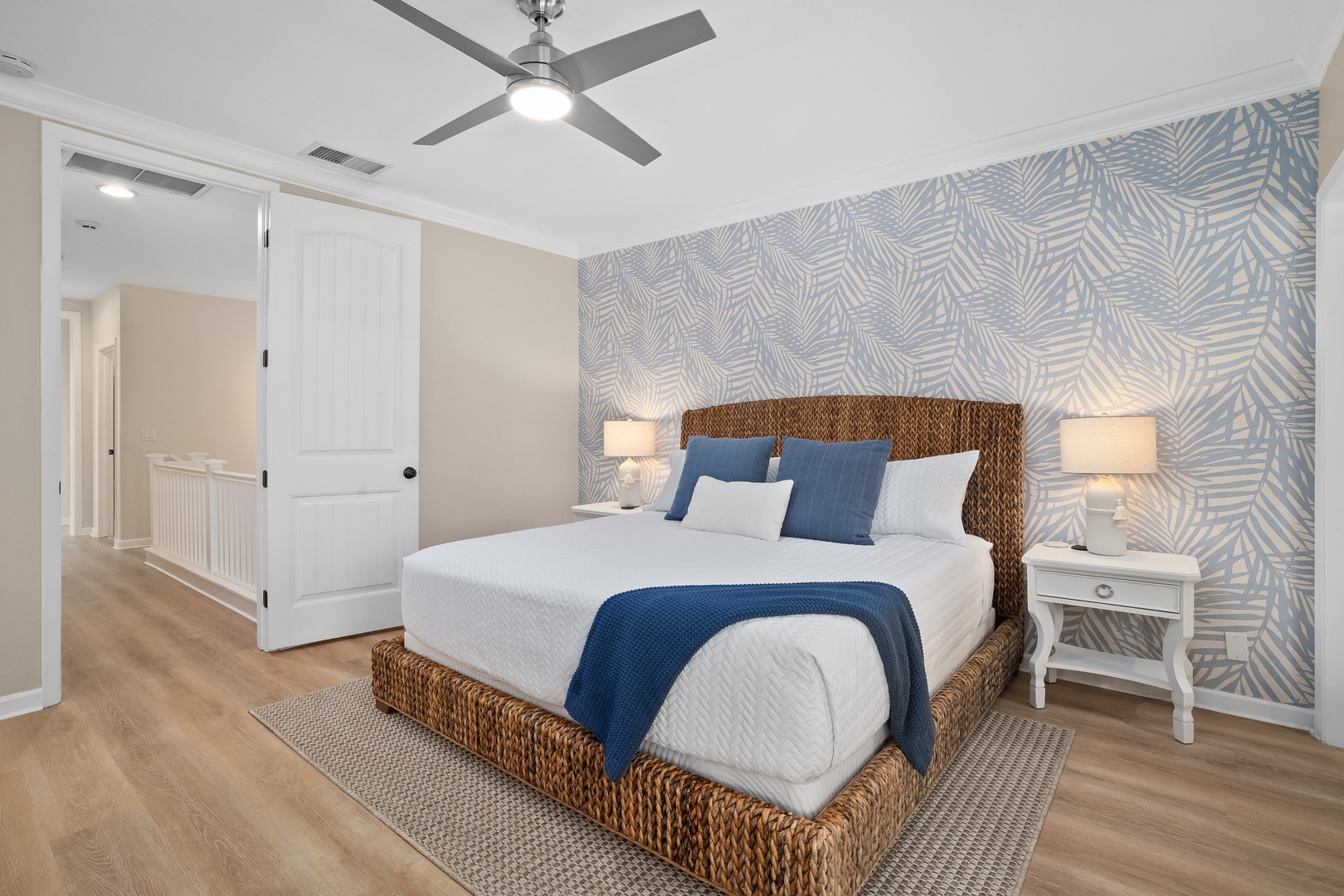 Princeville Vacation Rentals, Hale Kaua'i - Coastal-inspired details and soft lighting make this bedroom a relaxing place to recharge.