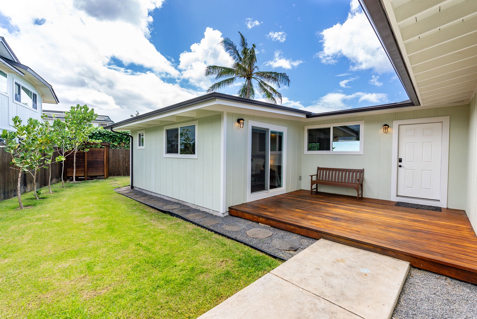 Waialua Vacation Rentals, Mokuleia Beach Villa** - The expansive lawn is perfect for games and provides plenty of space for children to play.