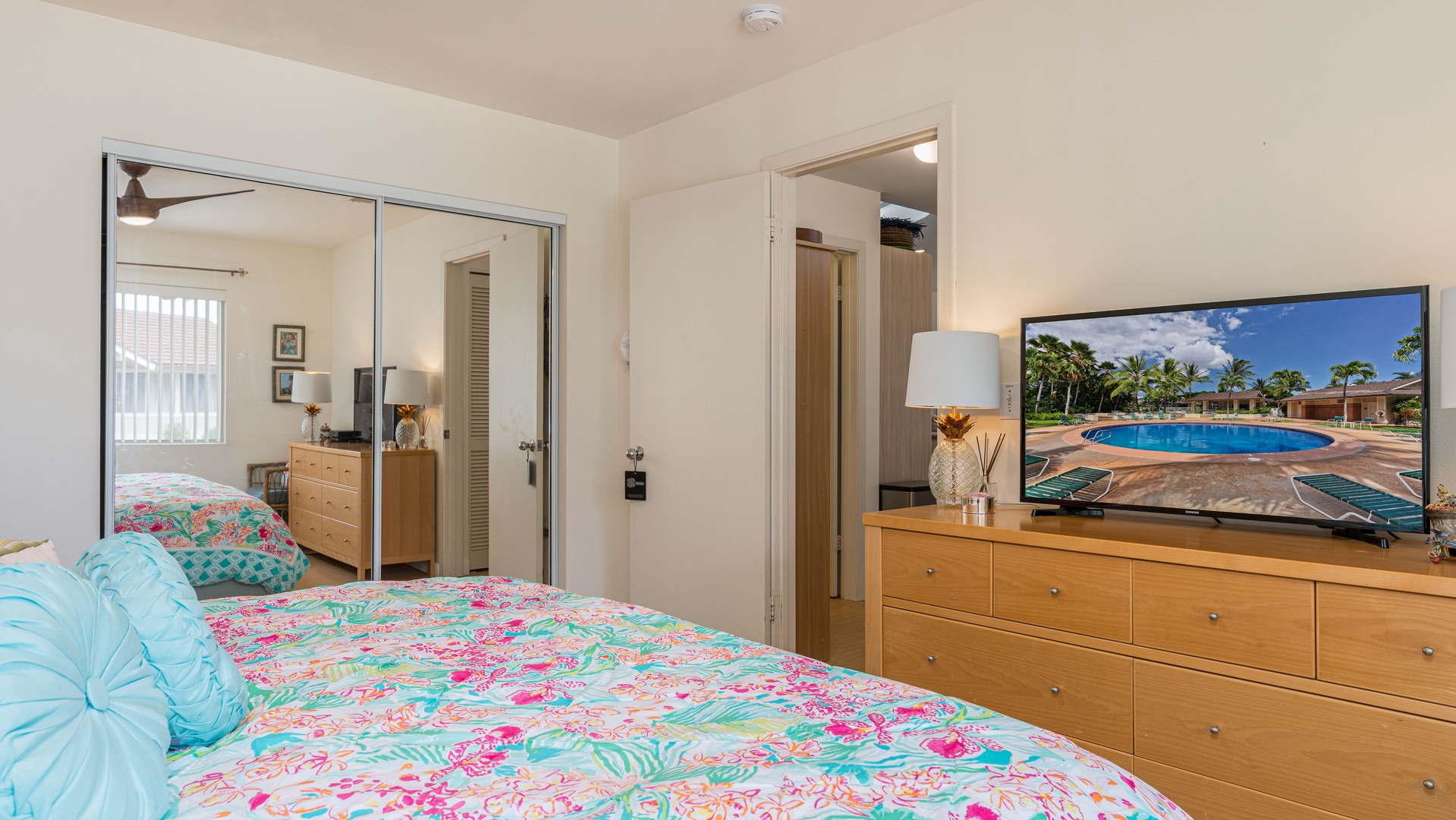 Kapolei Vacation Rentals, Fairways at Ko Olina 4A - The primary guest bedroom includes a dresser and television.