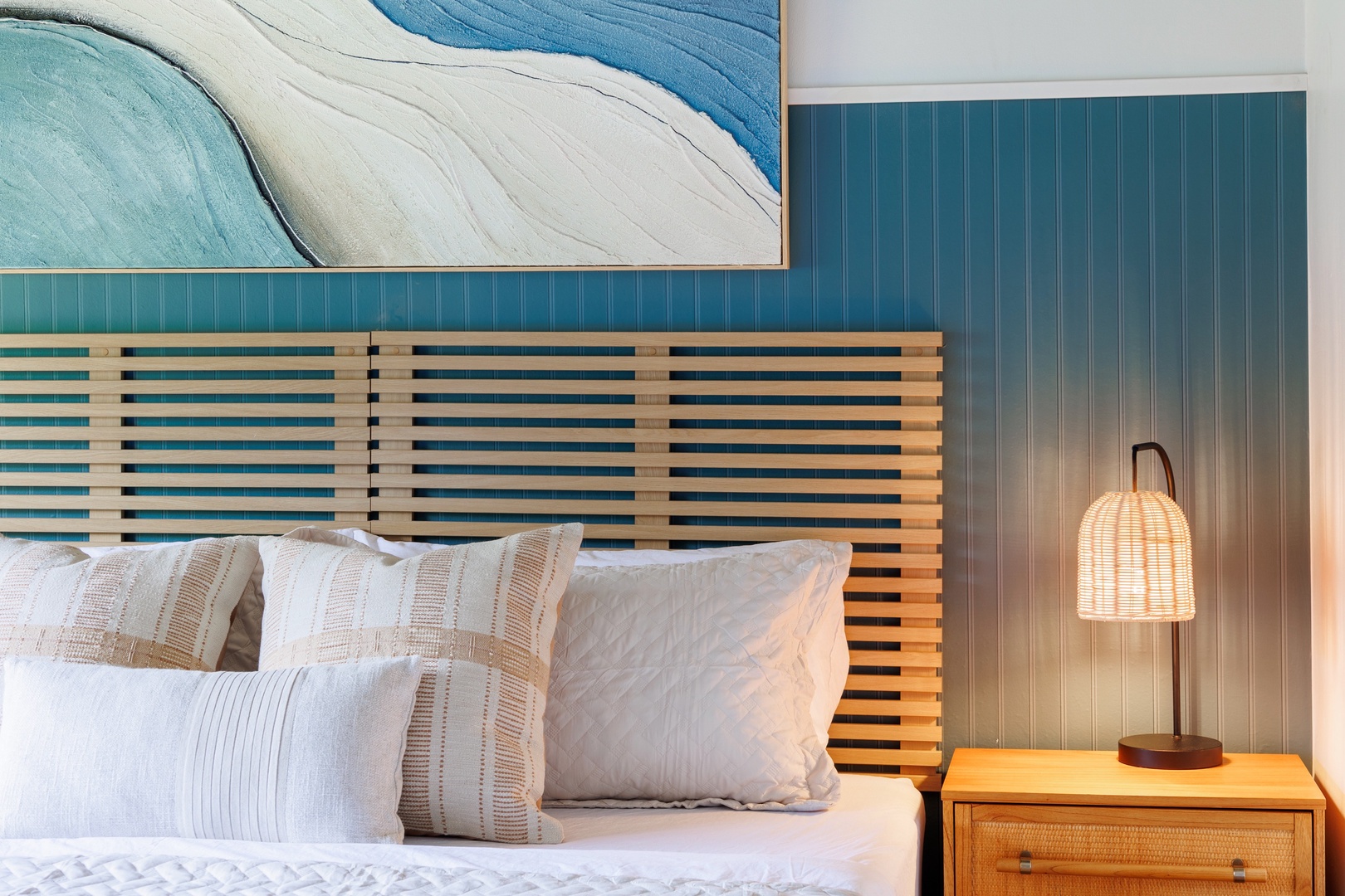 Kailua Kona Vacation Rentals, Keauhou Kai C301 - Slatted wood headboard, deep pillows, and a lamp for the last chapter of the night.