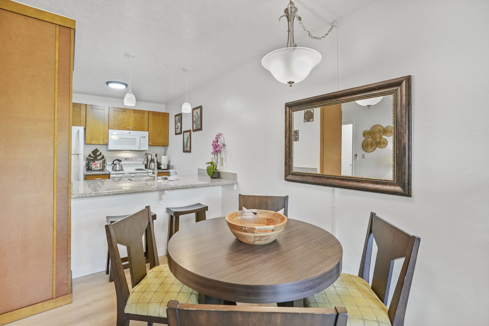 Kapaa Vacation Rentals, Kahaki Hale - A round dinette for four offers a charming space to enjoy breakfast or prep for the day, with easy access to the fully stocked kitchen.