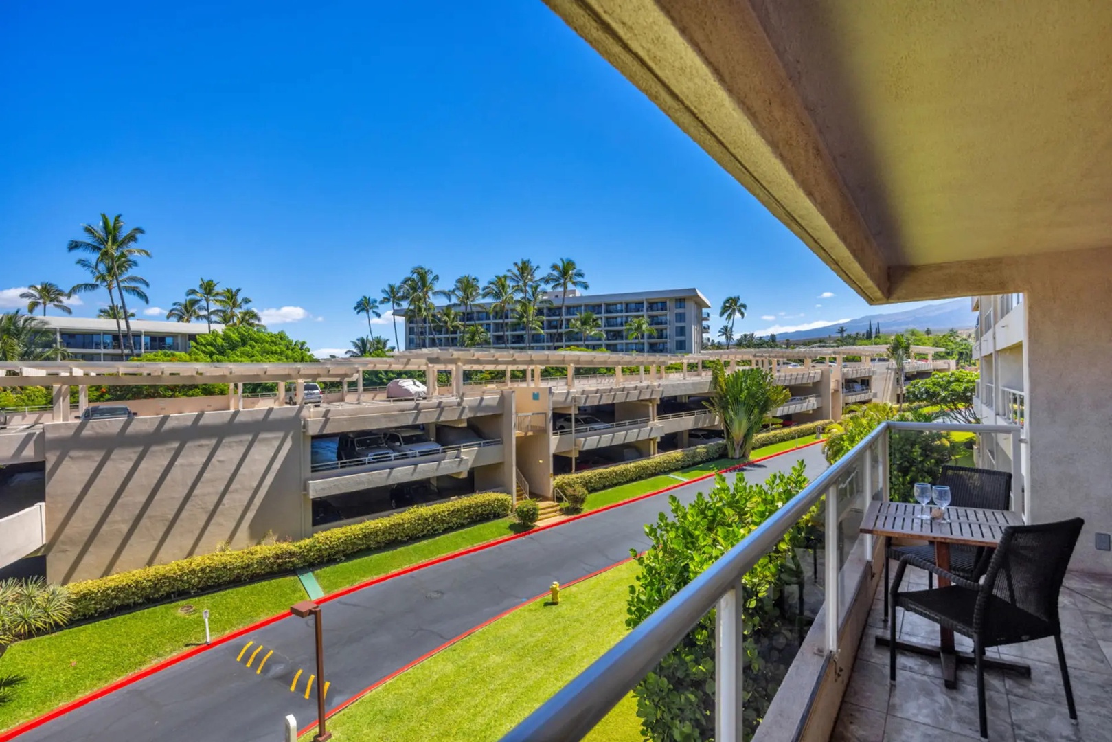 Kihei Vacation Rentals, Maui Banyan H306 - Pour the wine on the private lanai and let the palms and the mountain line do the rest.