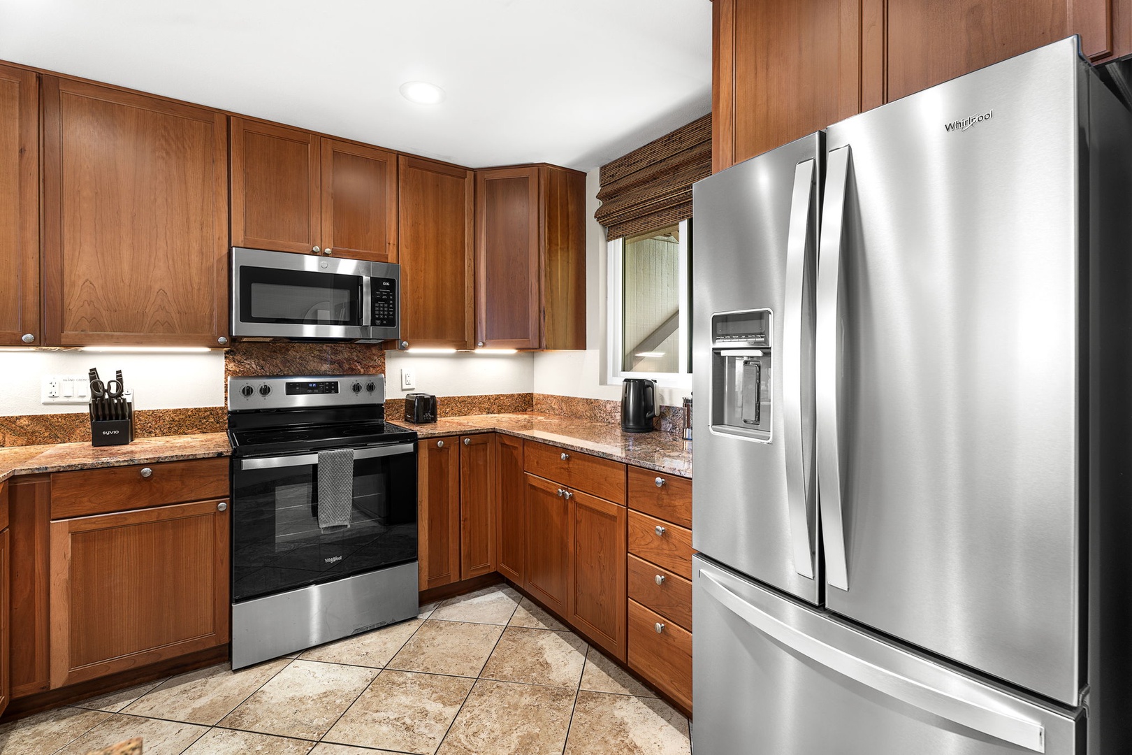Kailua Kona Vacation Rentals, Keauhou Kona Surf & Racquet 1104 - Full-size stainless fridge and range, so cooking for a crowd never runs short.
