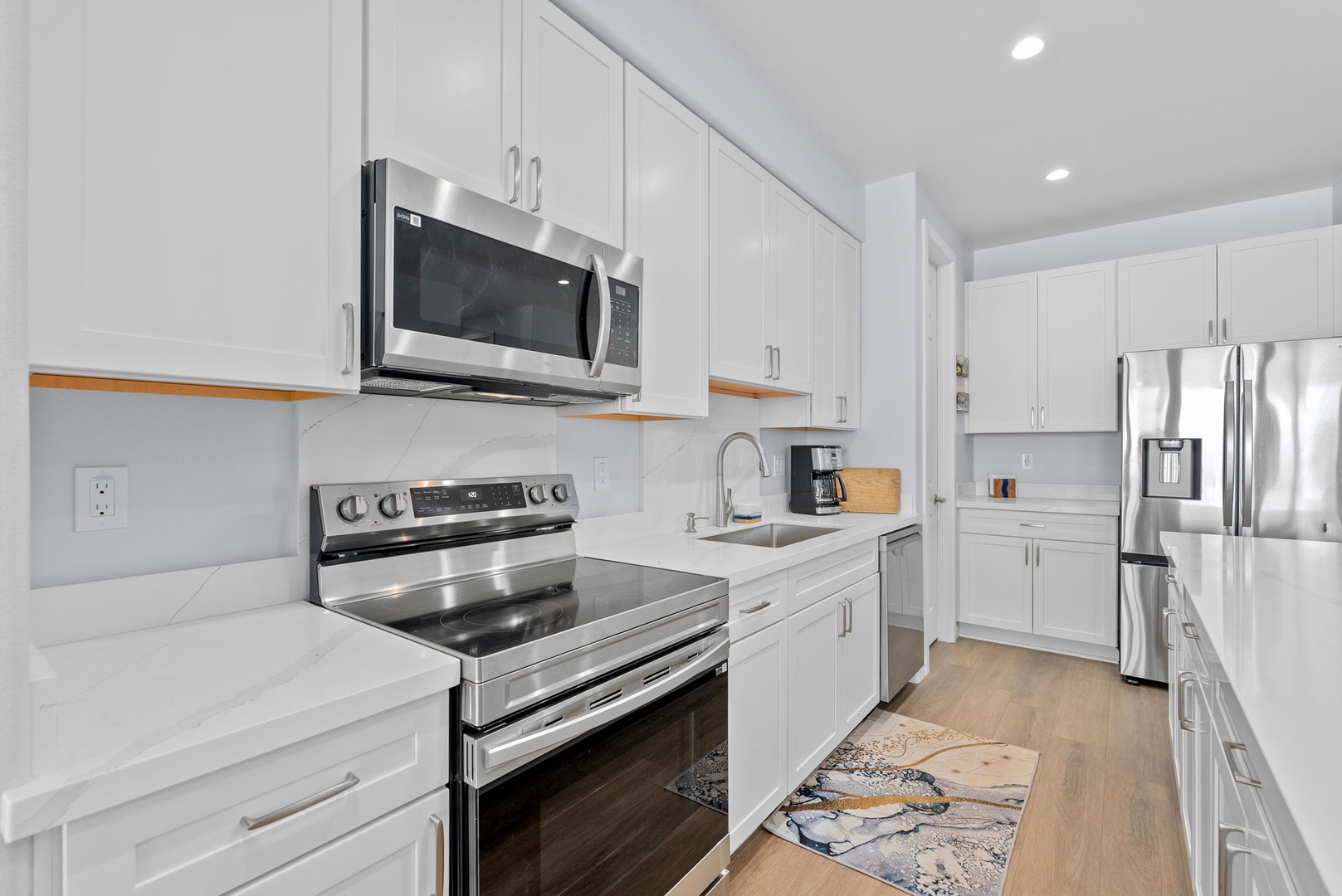 Waianae Vacation Rentals, Oceanfront Luxury Dream Estate - Custom kitchen with full-size range, deep pantry storage, and seamless cabinetry design.