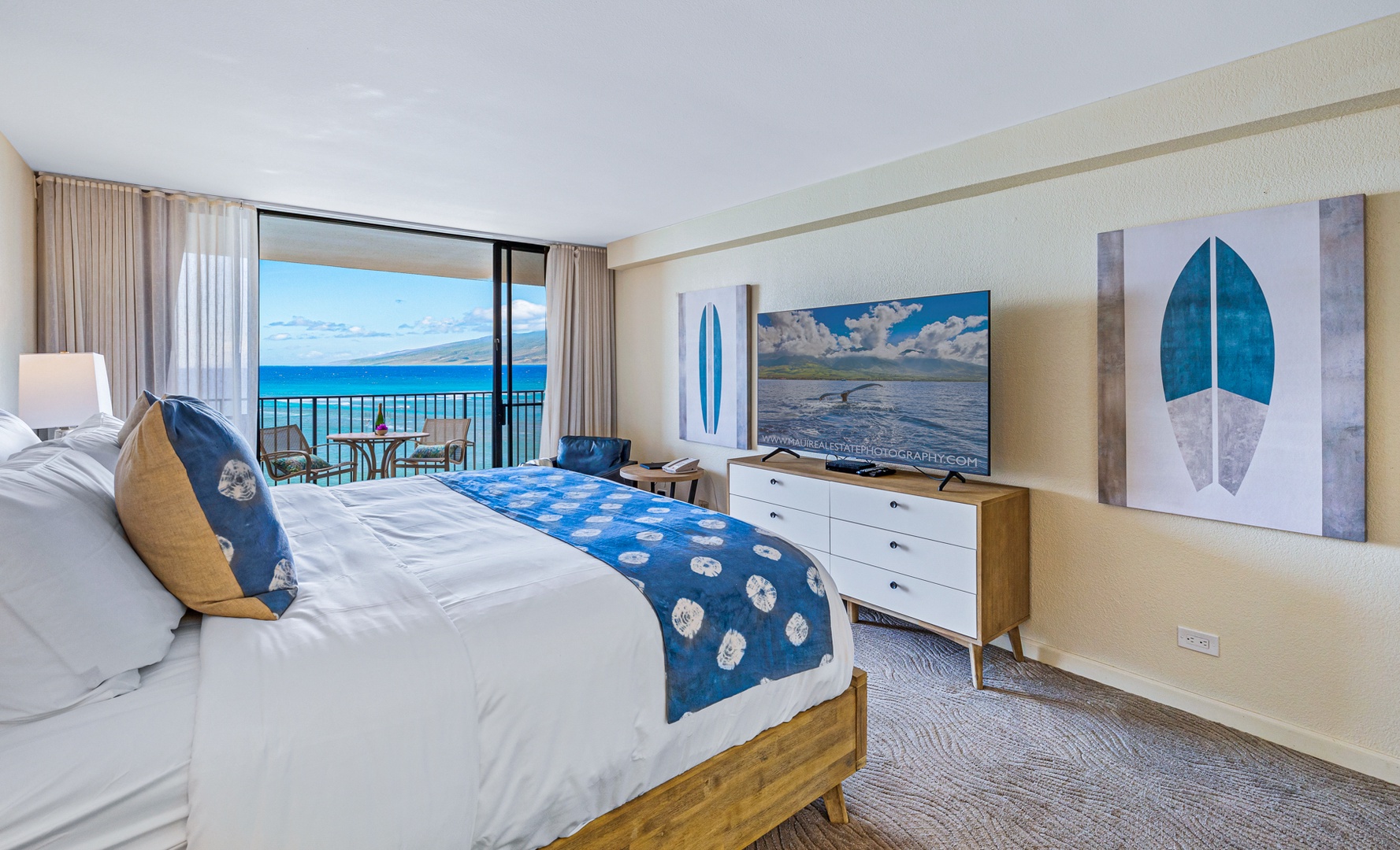 Lahaina Vacation Rentals, Kaanapali Shores 502 - Wake up to stunning ocean views from the comfort of this inviting bedroom, complete with a cozy seating area and private lanai access for a relaxing start to your day.