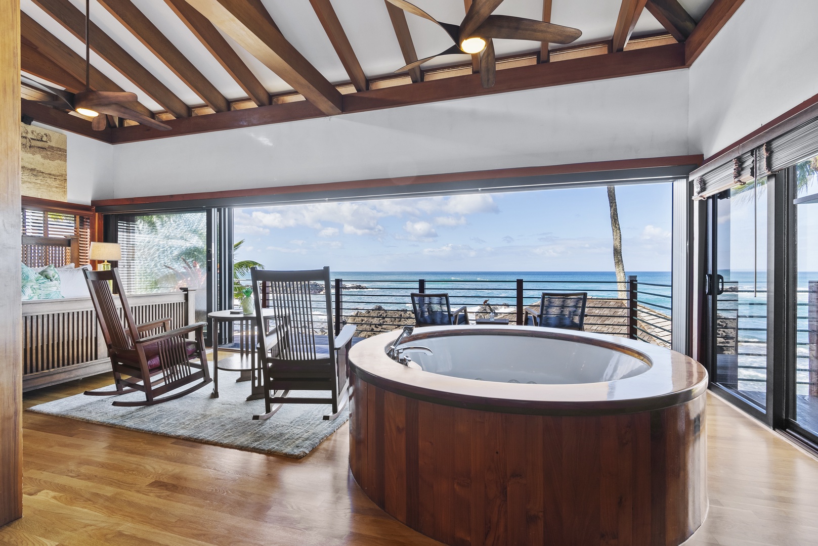 Haleiwa Vacation Rentals, Samurai House - Inviting primary bedroom with a private hot tub and ocean views.