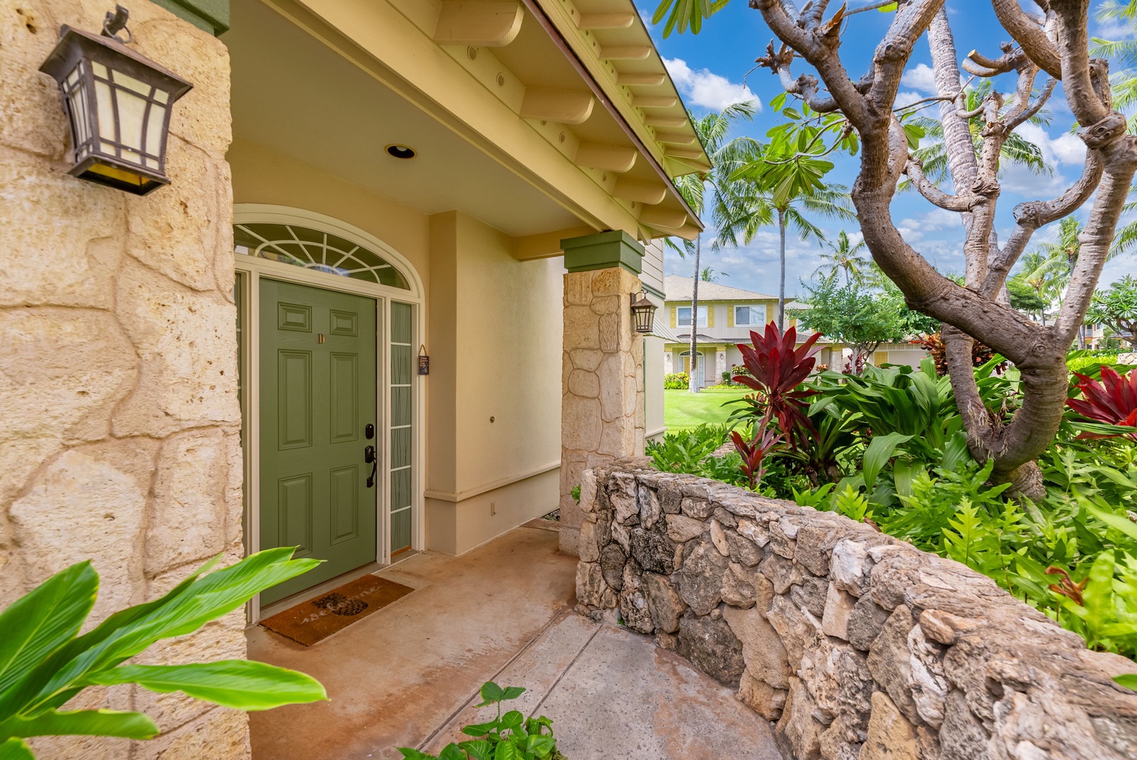 Kapolei Vacation Rentals, Kai Lani Luxury 6D - Welcoming entrance to Kai Lani Luxury 6D, featuring tropical plants and island-inspired architecture.