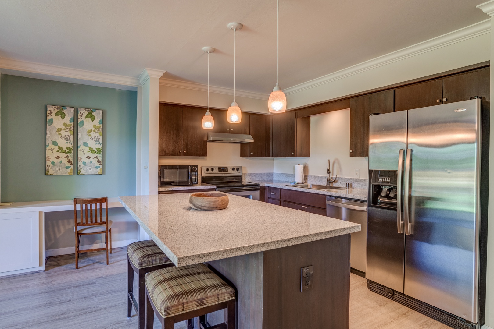 Kihei Vacation Rentals, Koa Resort 1B - Modern chef-ready kitchen with granite countertops and a central island for easy meal prep or morning coffee.