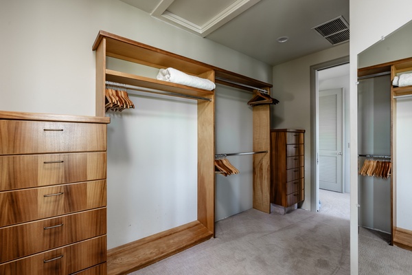 Kamuela Vacation Rentals, Canoe House & Beach Walker at Champion Ridge - Spacious walk-in closet with built-in shelving and ample storage space.