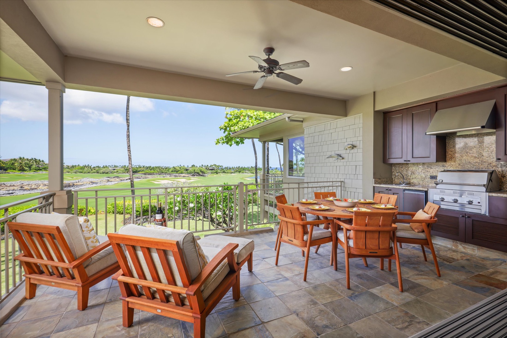 Kailua Kona Vacation Rentals, Wai'ulu Villa 115D - Covered lanai seating with ceiling fan and serene fairway views—perfect for morning coffee or evening wine.