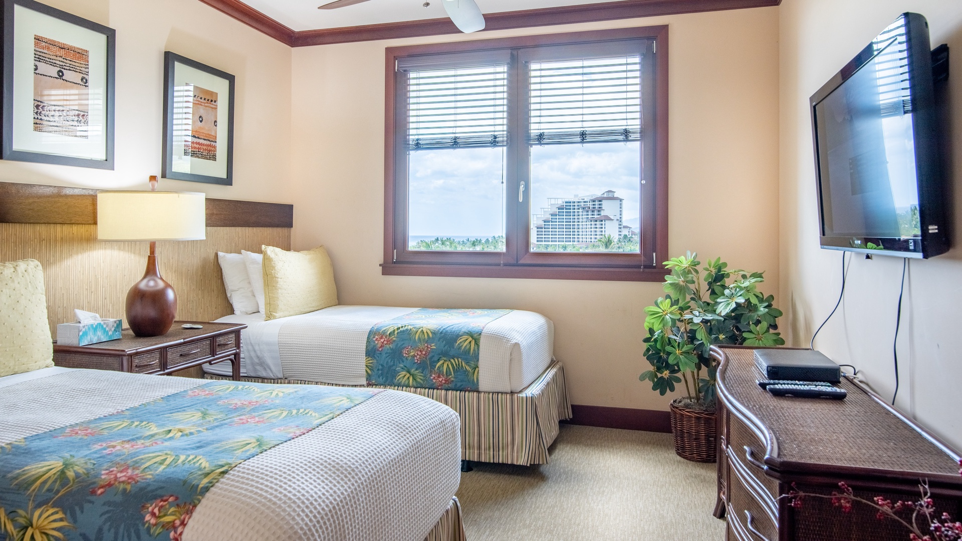 Kapolei Vacation Rentals, Ko Olina Beach Villas B608 - The second guest suite is decorated with bright tropical patterns and framed island-inspired art for a true Hawaii experience.