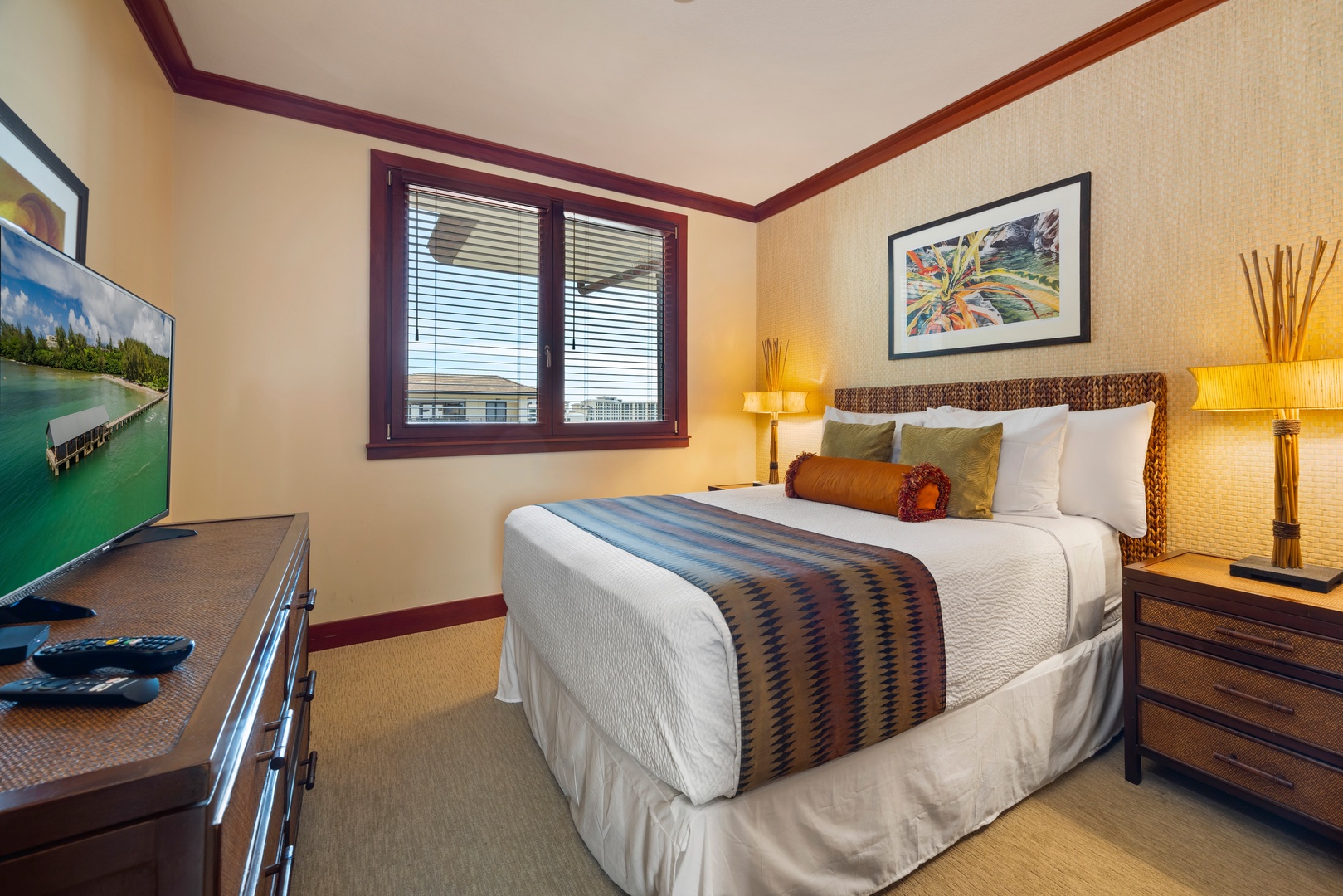 Kapolei Vacation Rentals, Ko Olina Beach Villas O1111 - Unwind in your tropical-themed bedroom with plush bedding, warm lighting, and modern amenities creating the perfect retreat.