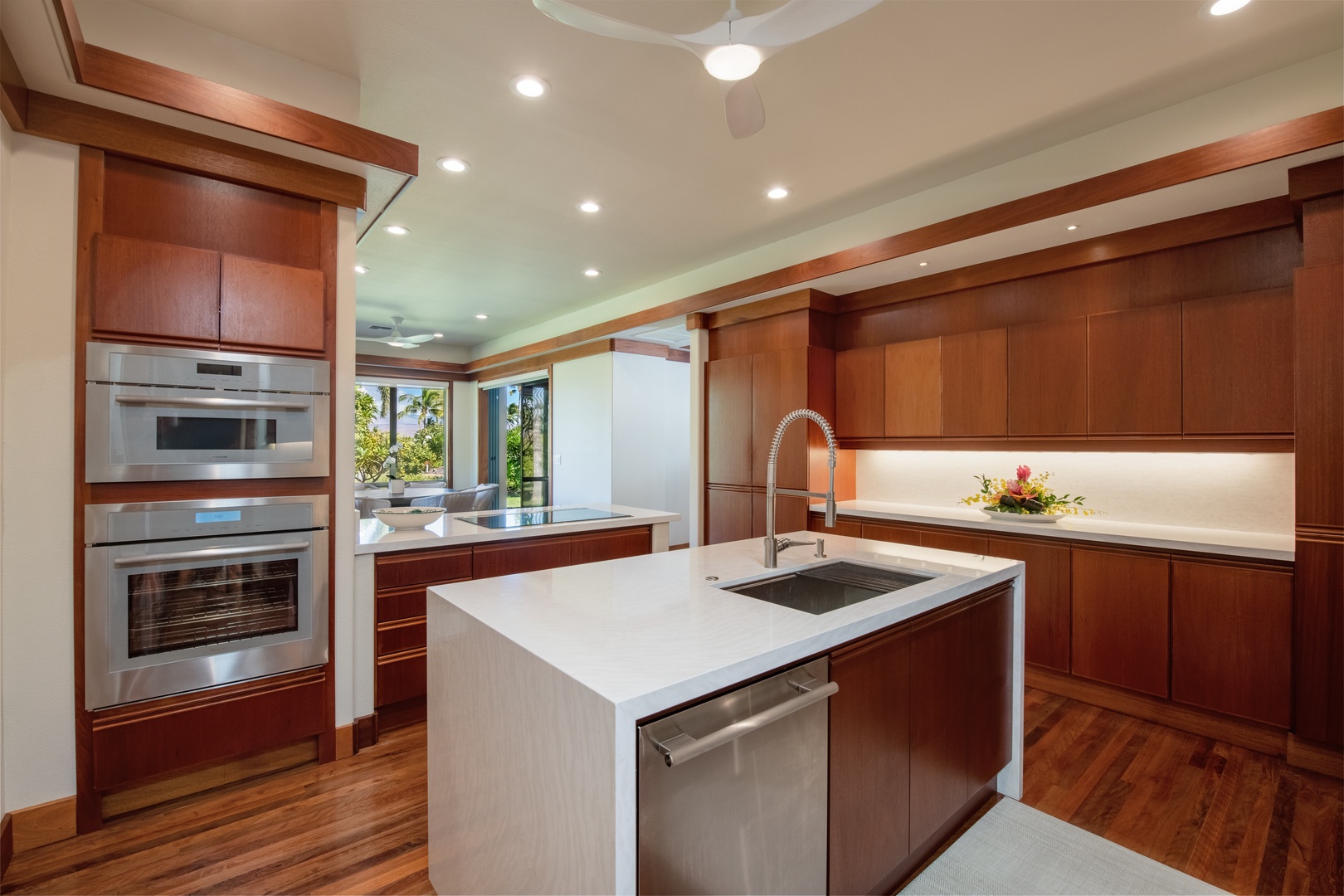 Kamuela Vacation Rentals, Champion Ridge Elegance - Sleek, fully equipped kitchen with modern wood accents and premium appliances.