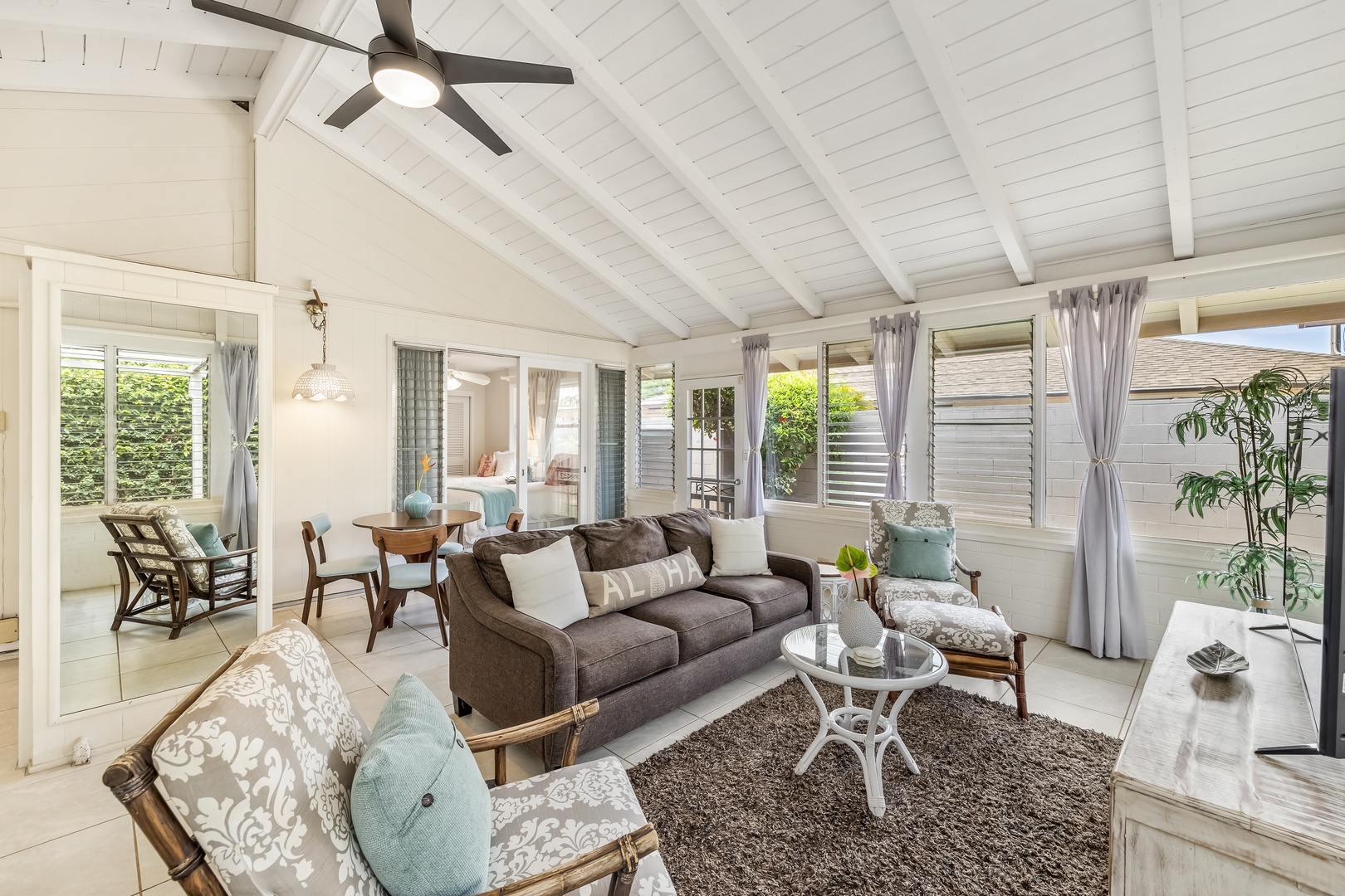 Honolulu Vacation Rentals, Kahala Cottage - Front living room with high, vaulted ceiling.