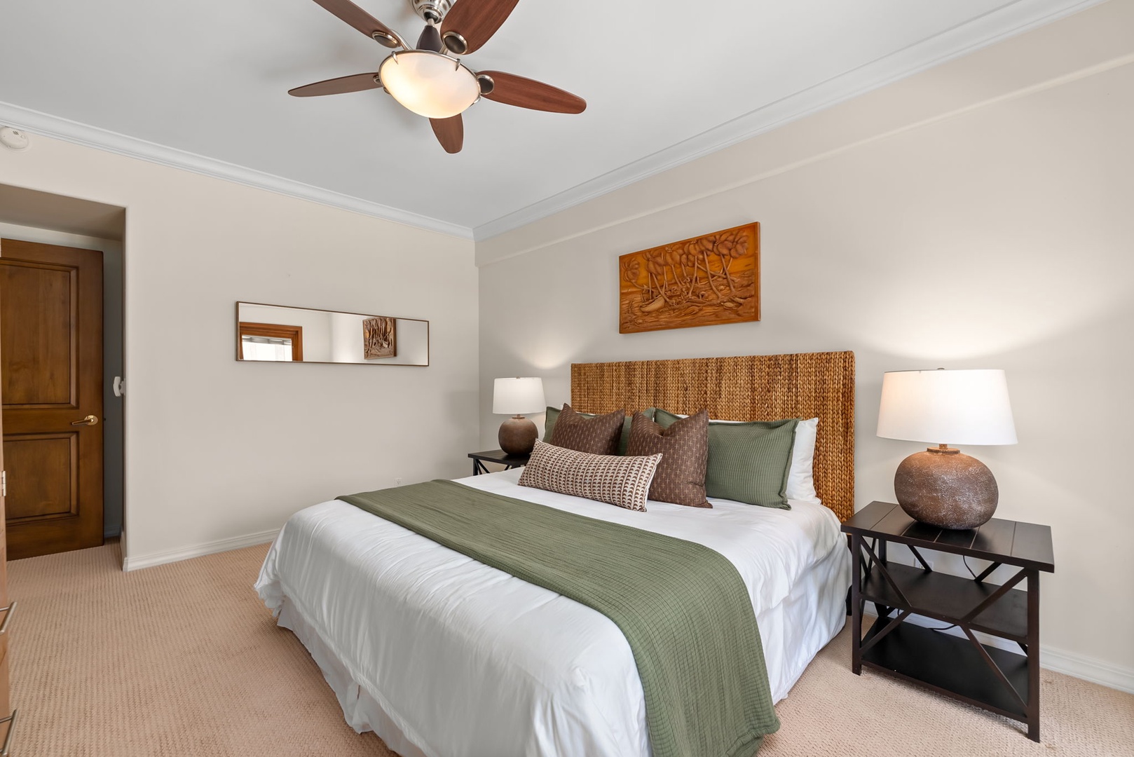 Honolulu Vacation Rentals, Maunalua Estate - Plush bedding and warm wood accents bring comfort and simplicity to this inviting bedroom.