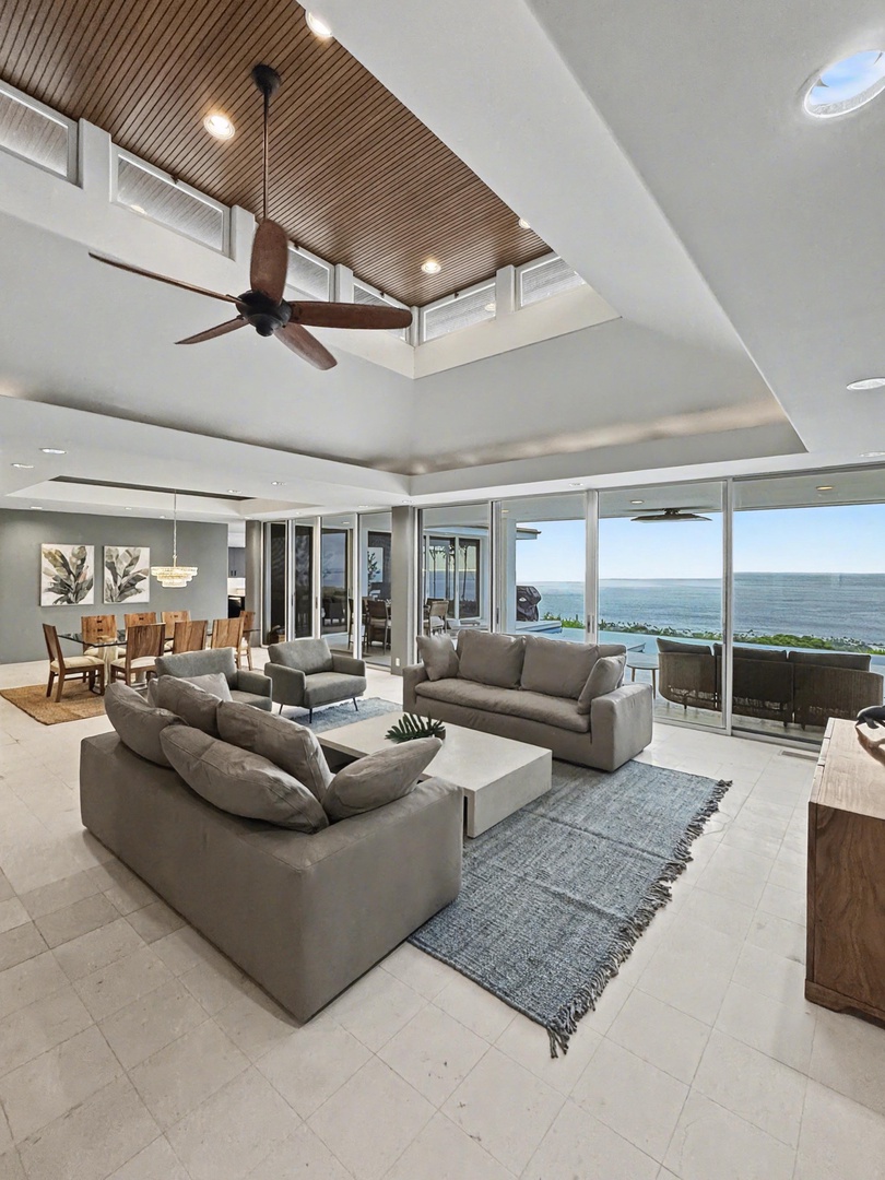 Kailua Kona Vacation Rentals, Hale Nai'a - Ocean-facing living room with floor-to-ceiling windows and seamless indoor-outdoor flow.