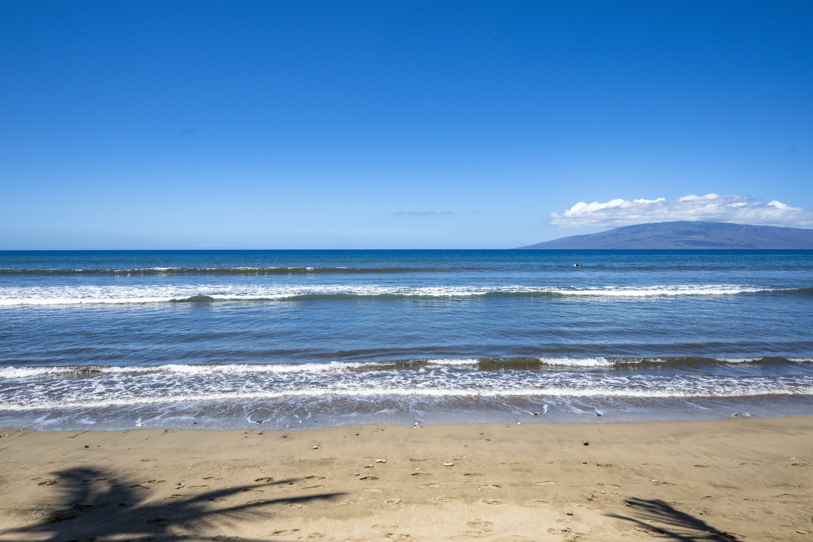 Lahaina Vacation Rentals, Puamana 240-3 - Unwind beside the calming waves and golden sands, the perfect beachside setting for morning strolls or evening reflections.