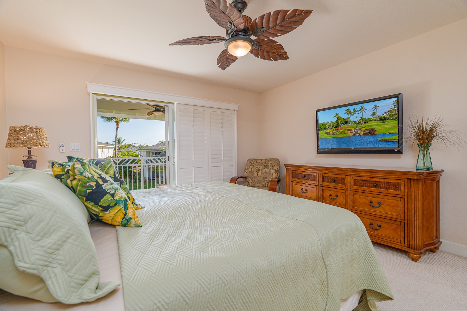 Kapolei Vacation Rentals, Ko Olina Kai 1097C - Primary suite with TV and access to private lanai.