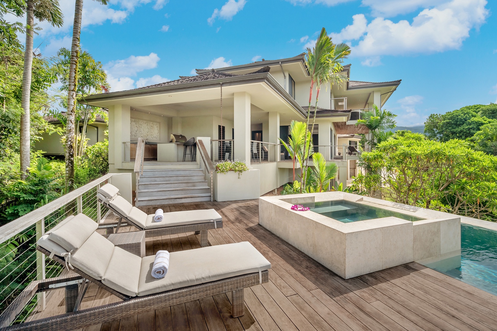 Princeville Vacation Rentals, Hanalei Plantation Villa - Relax in the outdoor spa with lounge seating, surrounded by tropical greenery for ultimate privacy.