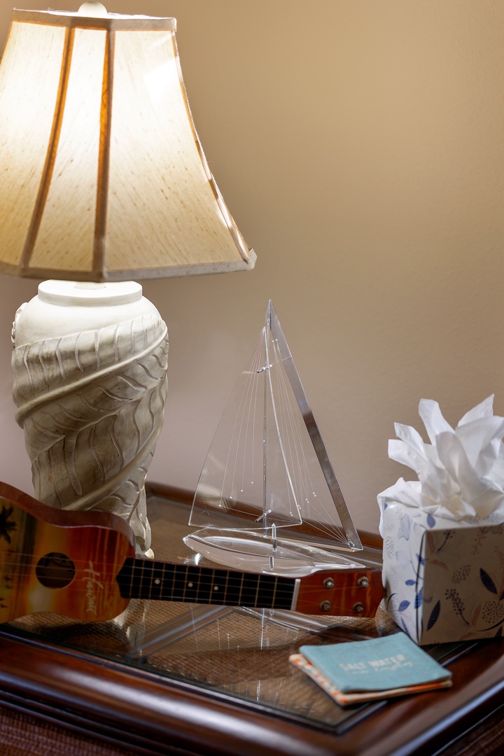 Relax in your thoughtfully decorated space with charming nautical touches and warm ambient lighting creating a cozy retreat atmosphere.