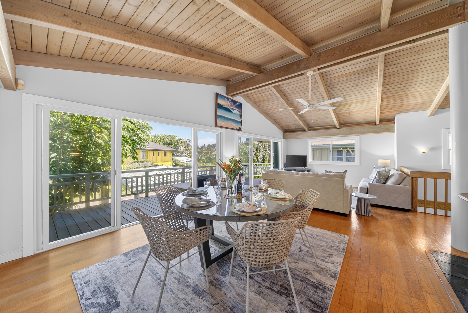 Haleiwa Vacation Rentals, Sunset Beach Hideaway - Share breakfast or evening meals beside large windows and tropical greenery.