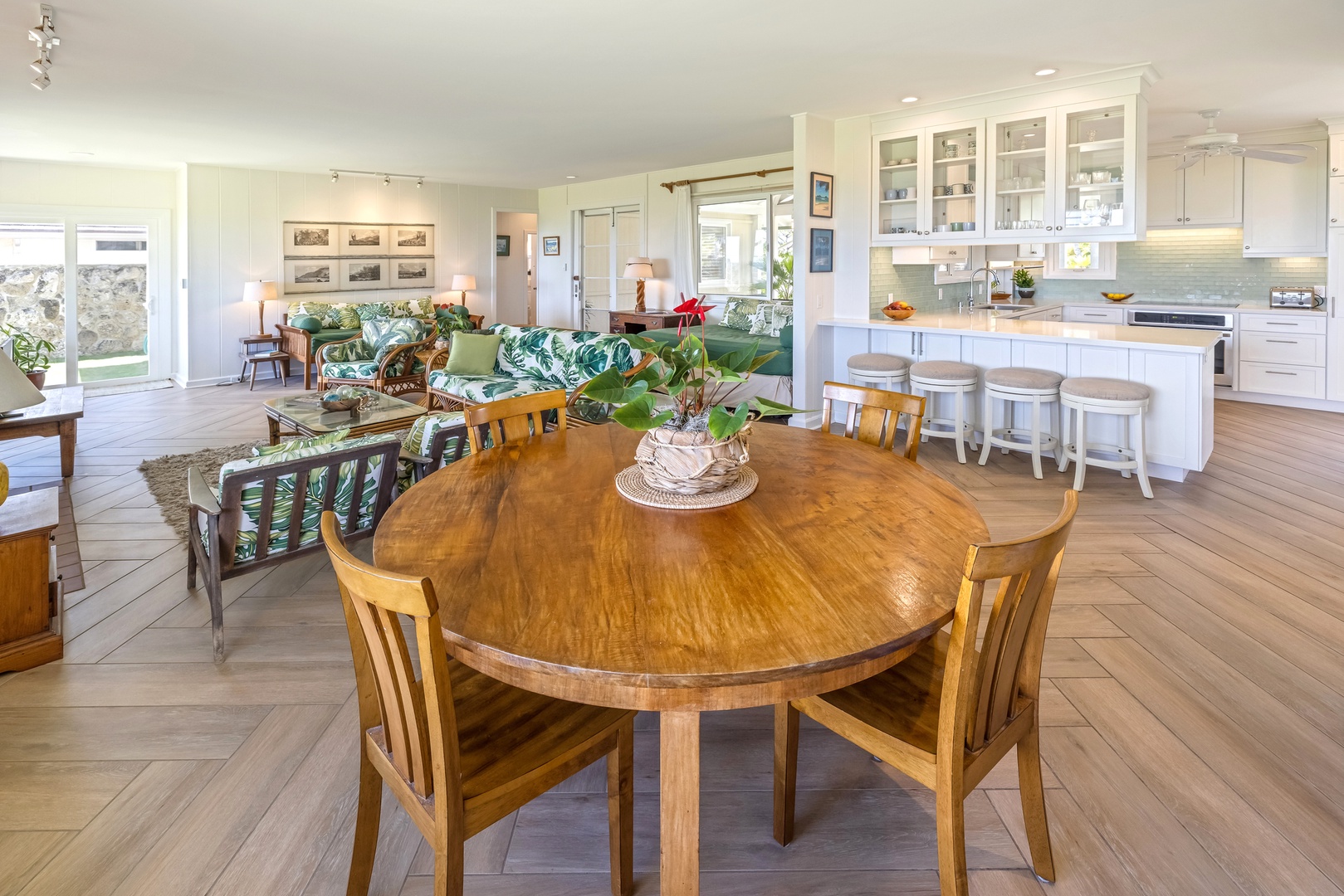 Kailua Vacation Rentals, Hale Moana Lanikai - Gather round this charming wooden dining table set against a backdrop of an expansive, light-filled living area